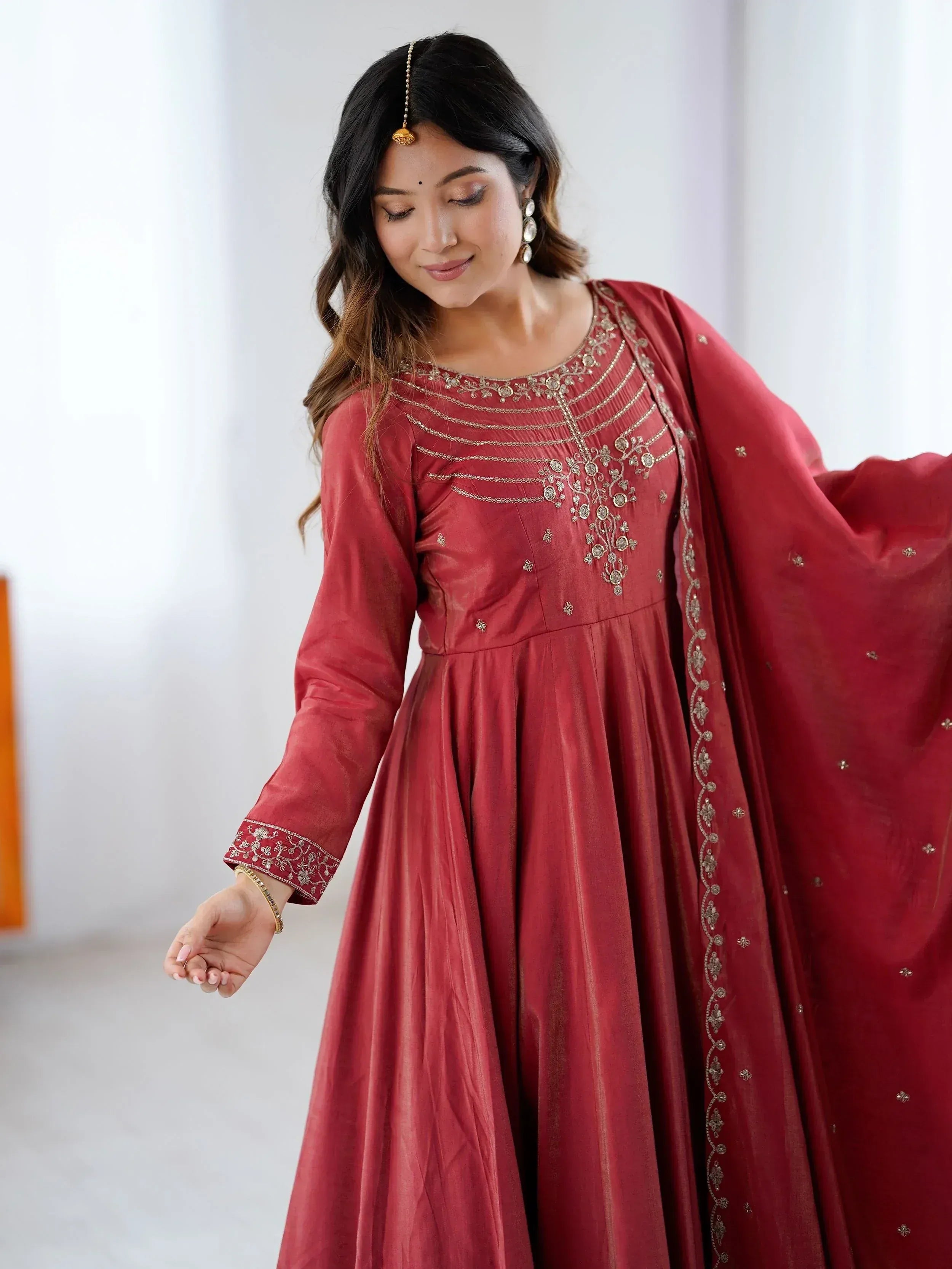 Red ethnic anarkali gown with gold embroidery, perfect for Indian occasions and festive wear