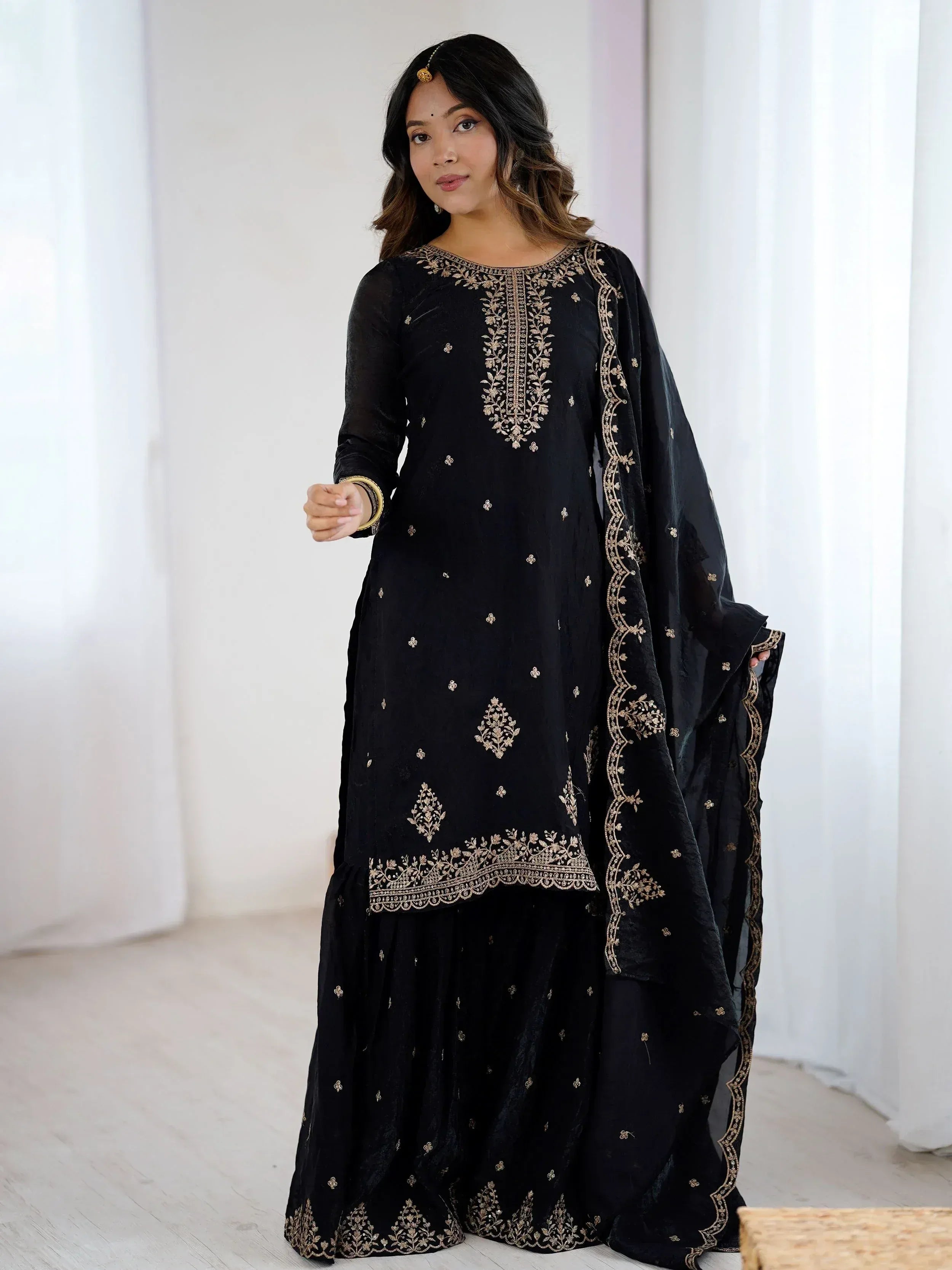 Black embroidered salwar kameez with gold detailing, ethnic Indian wear for women