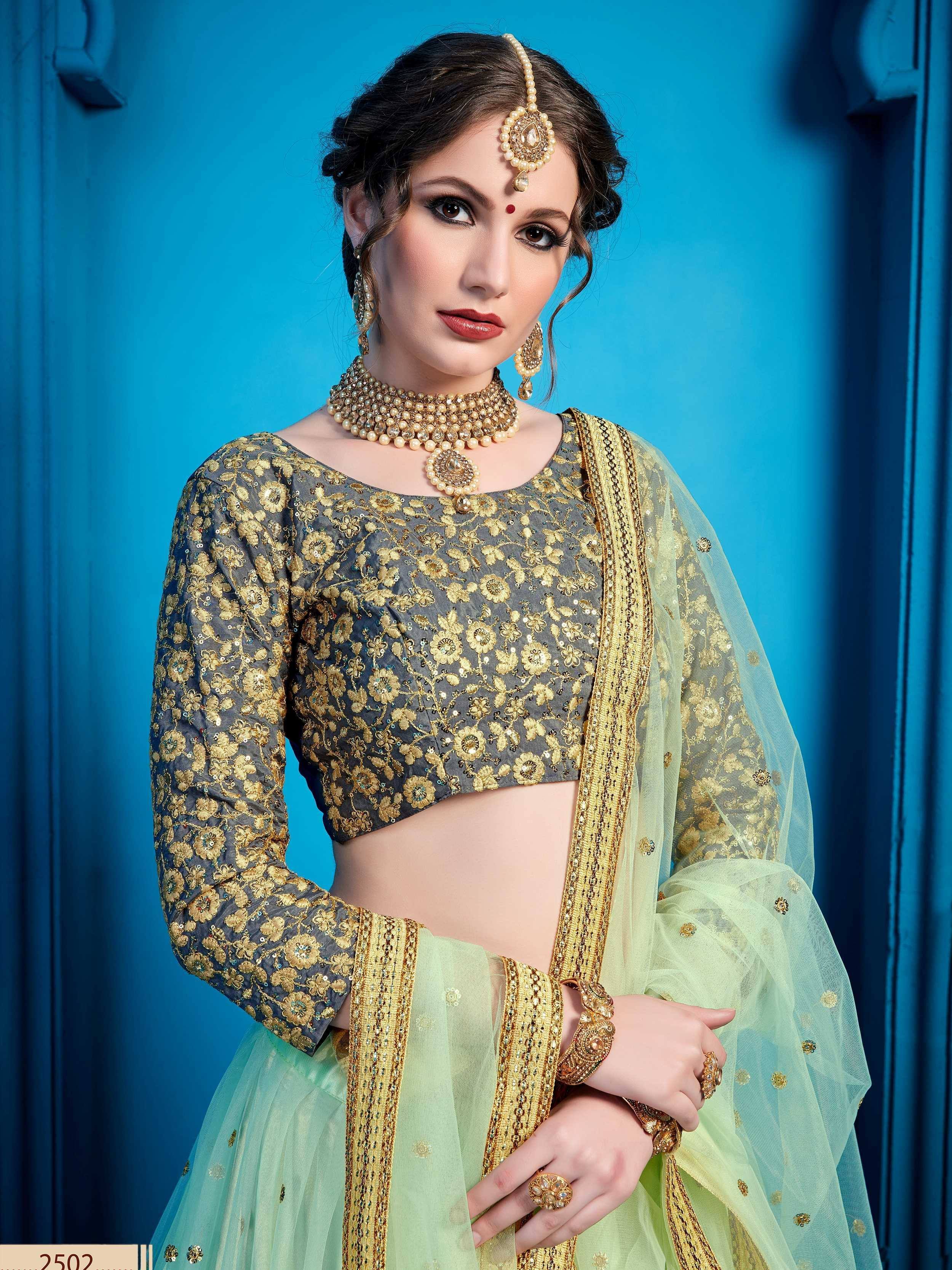 Grey and mint green embroidered lehenga choli with gold floral work and matching jewelry