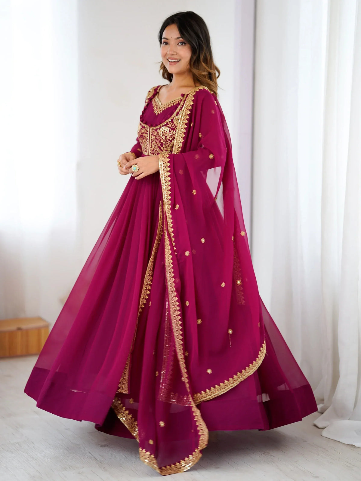 Magenta designer anarkali with gold embroidery, perfect for Indian ethnic wear occasions
