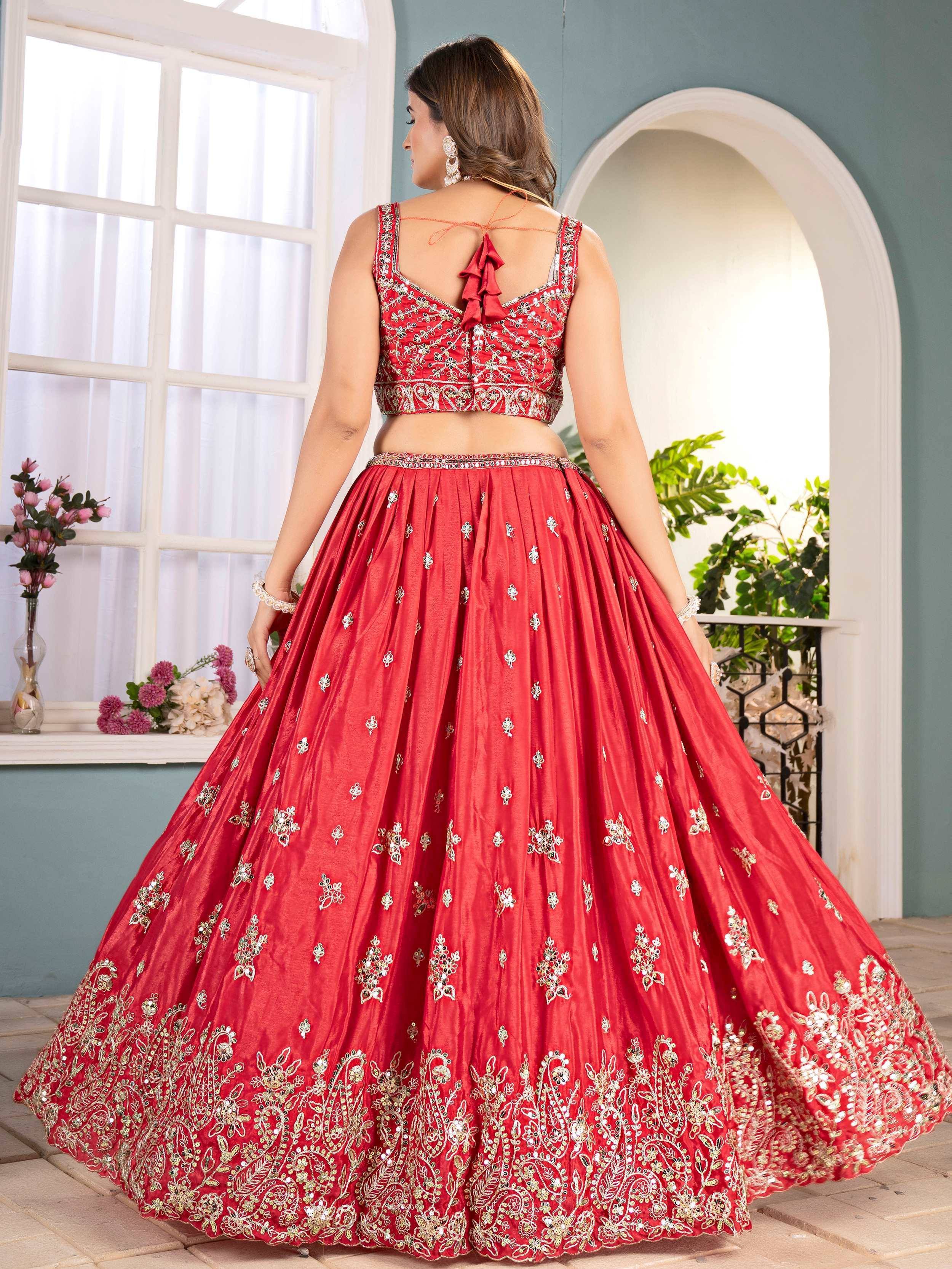 Red embroidered lehenga choli with floral motifs, perfect for Indian weddings and festive occasions