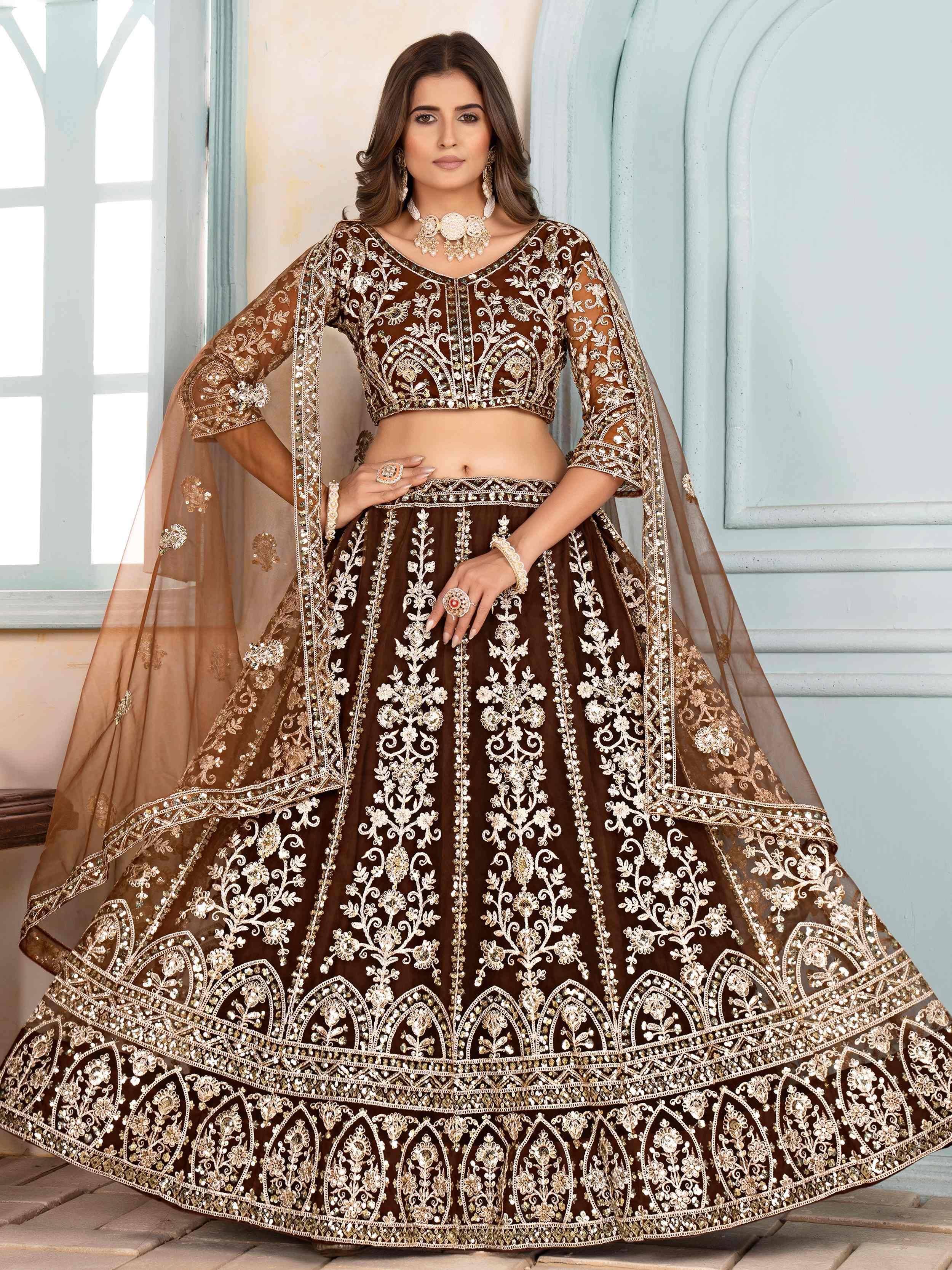 Brown embroidered lehenga choli with gold floral work, perfect for Indian weddings and festive occasions.