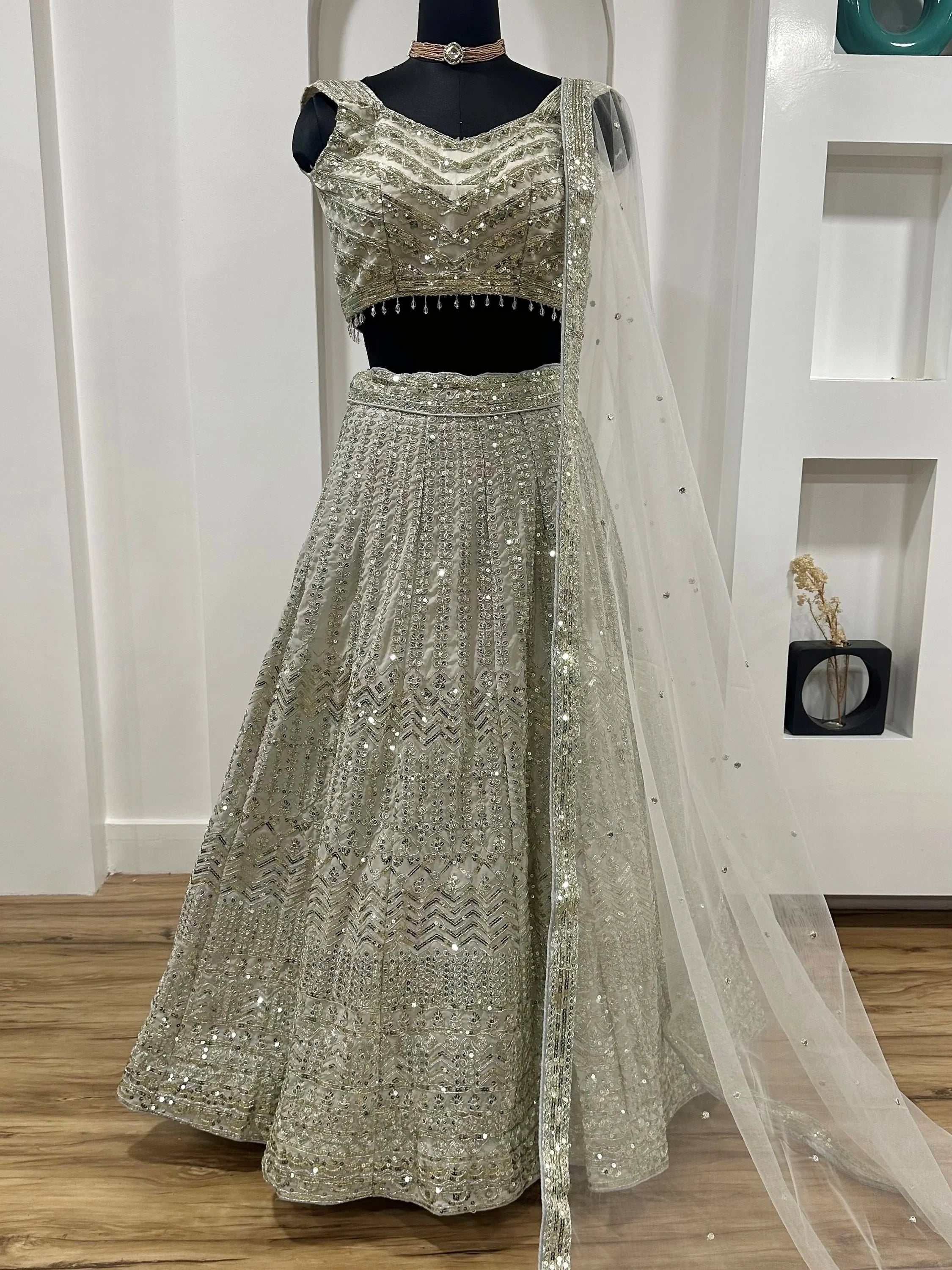 Luxurious Off White Georgette Sequins Bridesmaid Lehenga Choli