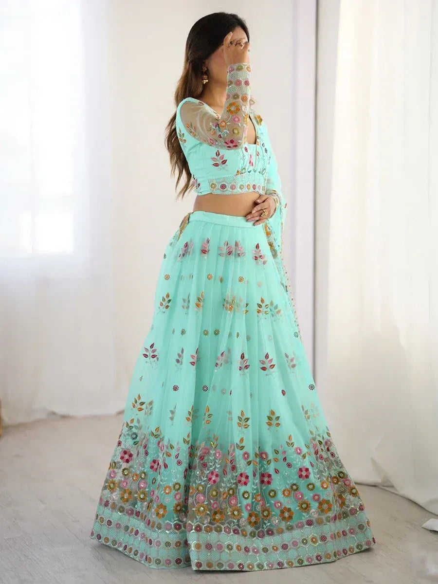 Mint green floral embroidered lehenga choli with sheer sleeves, perfect for Indian ethnic occasions
