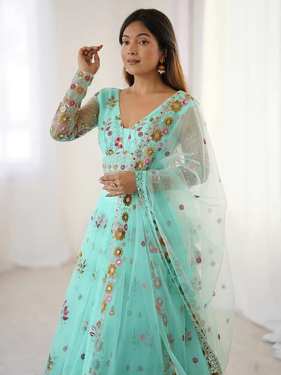 Mint green embroidered lehenga choli with floral motifs and sheer dupatta, ideal for Indian ethnic occasions