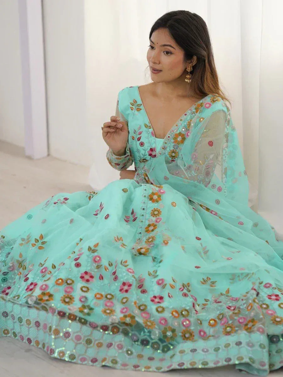 Mint green floral embroidered lehenga choli with sheer dupatta, perfect for Indian ethnic occasions