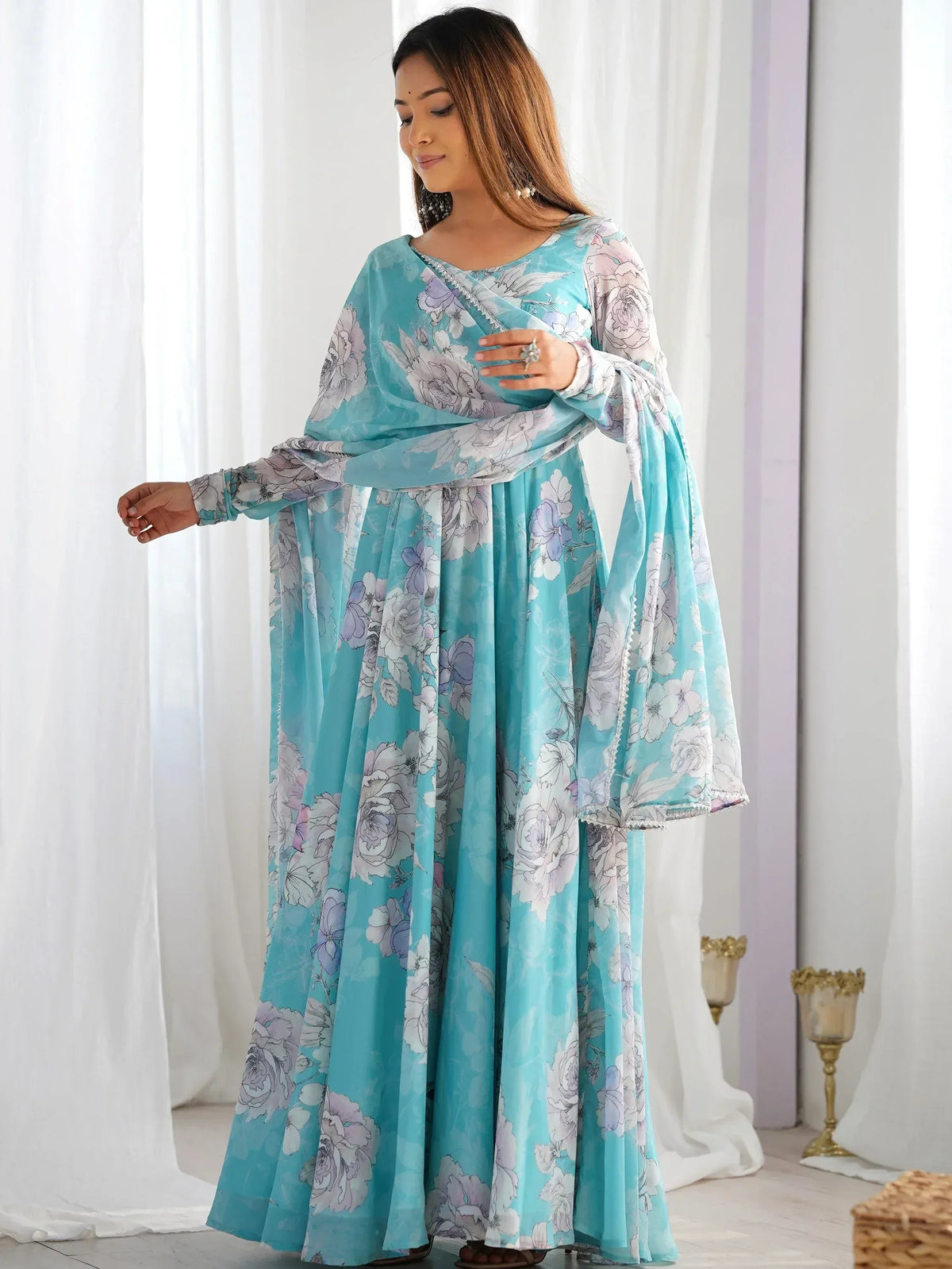 Turquoise floral print ethnic gown with matching dupatta, perfect for Indian occasions and festive wear.