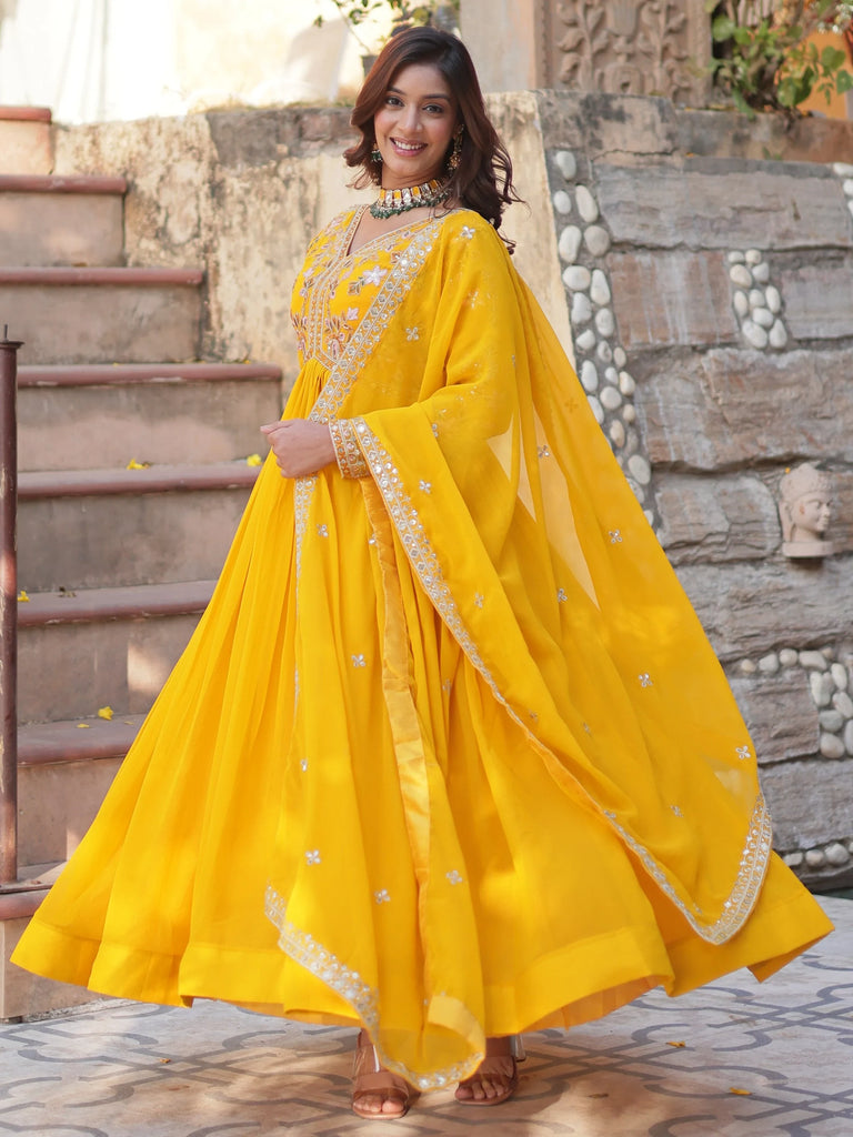 Artistic Yellow Thread Work Georgette Haldi Wear Gown With Dupatta