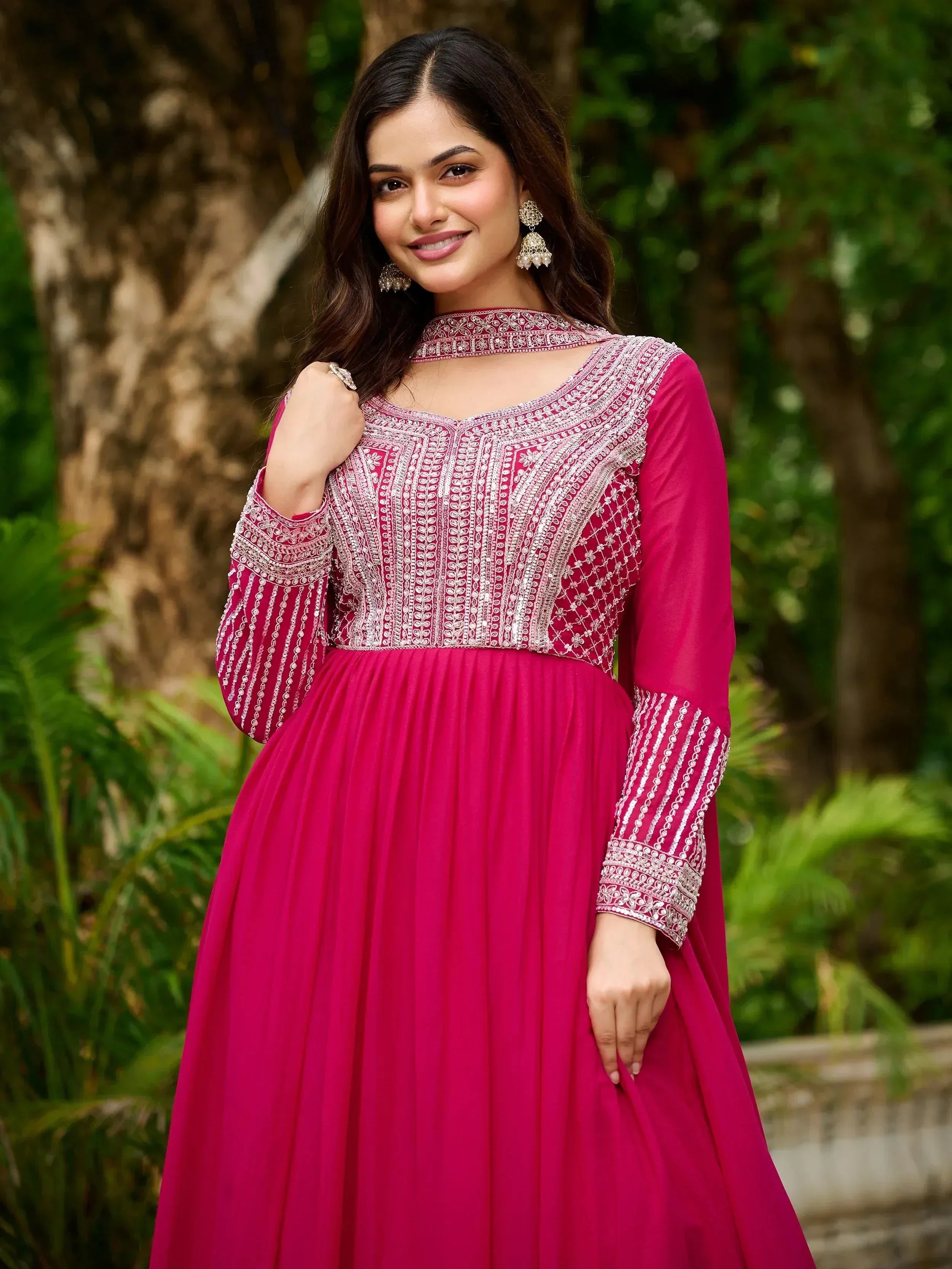 Pink embroidered ethnic gown with silver detailing, perfect for festive occasions and Indian celebrations