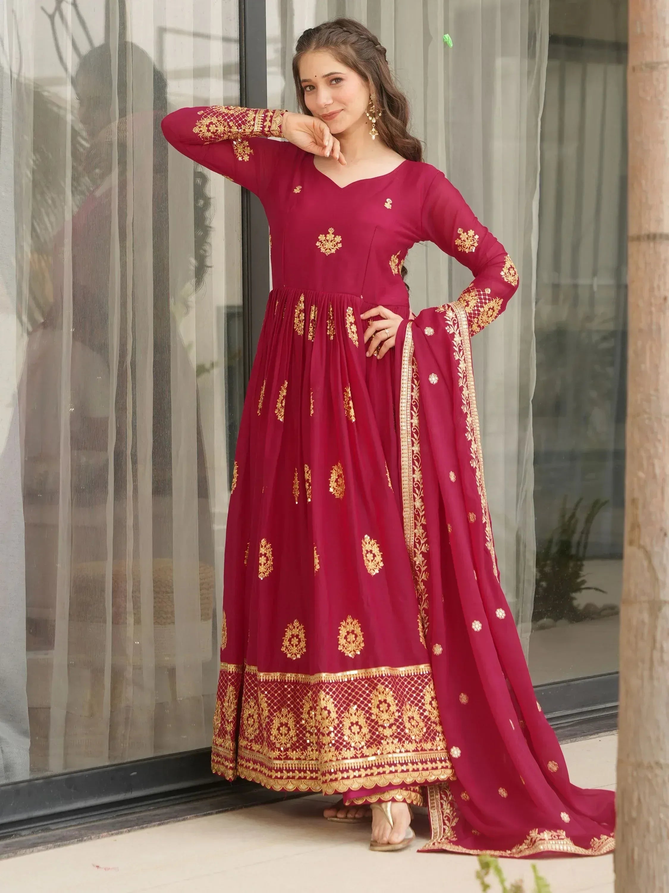 Maroon ethnic anarkali with gold embroidery, perfect for Indian weddings and festive occasions