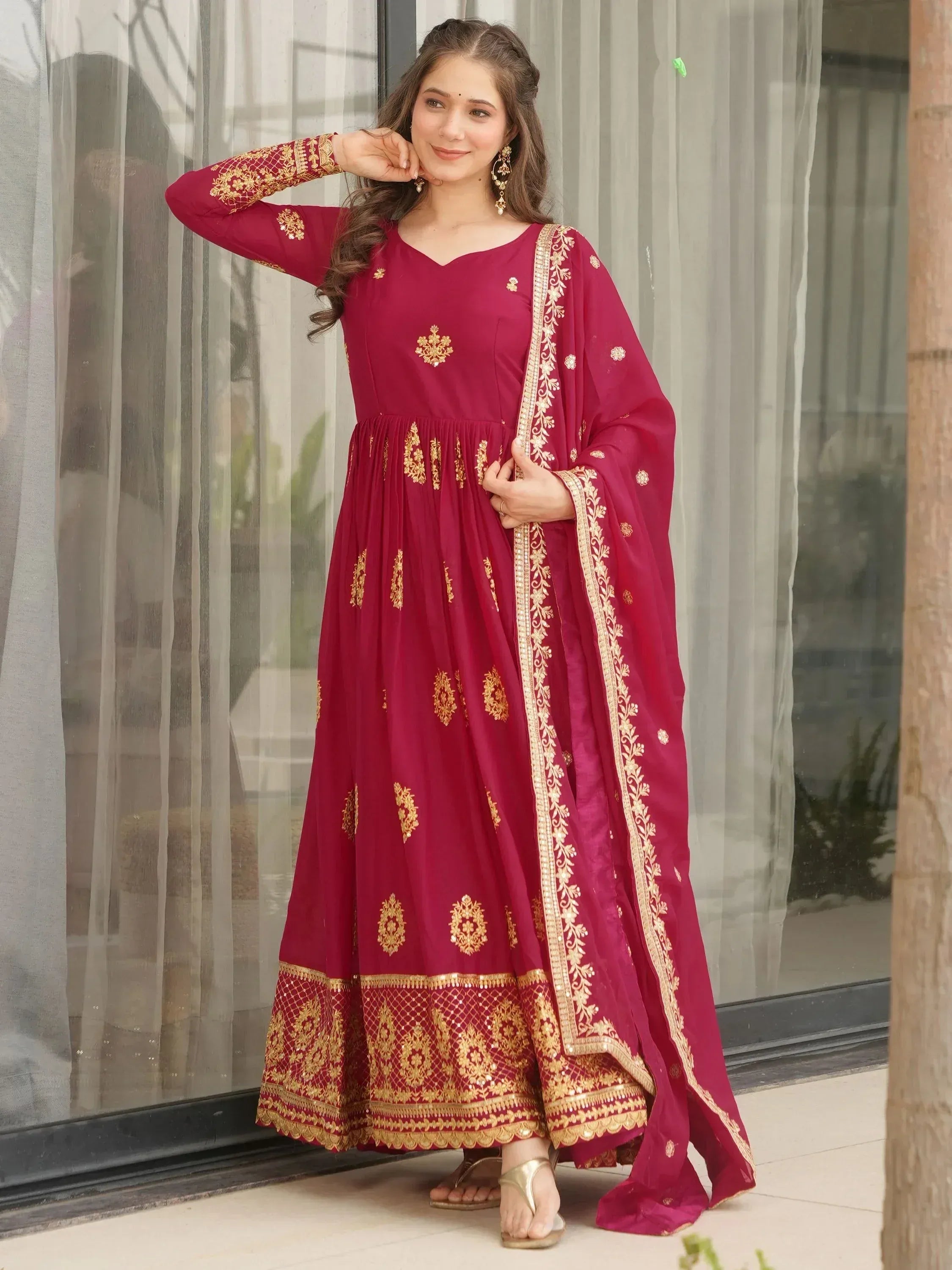 Maroon ethnic anarkali with gold embroidery and dupatta, perfect for Indian festive occasions
