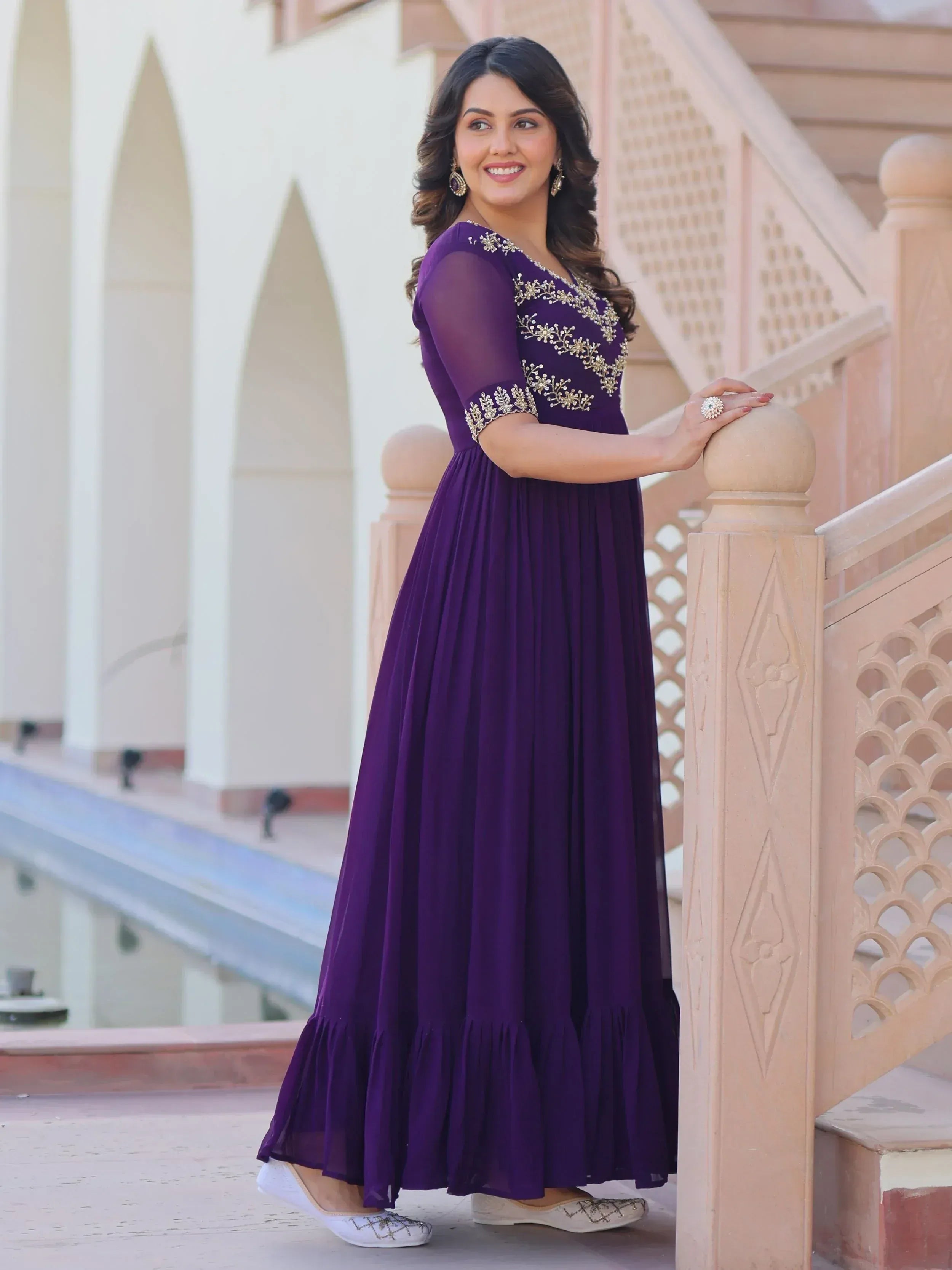Purple ethnic gown with gold embroidery, perfect for Indian occasions and festive wear.