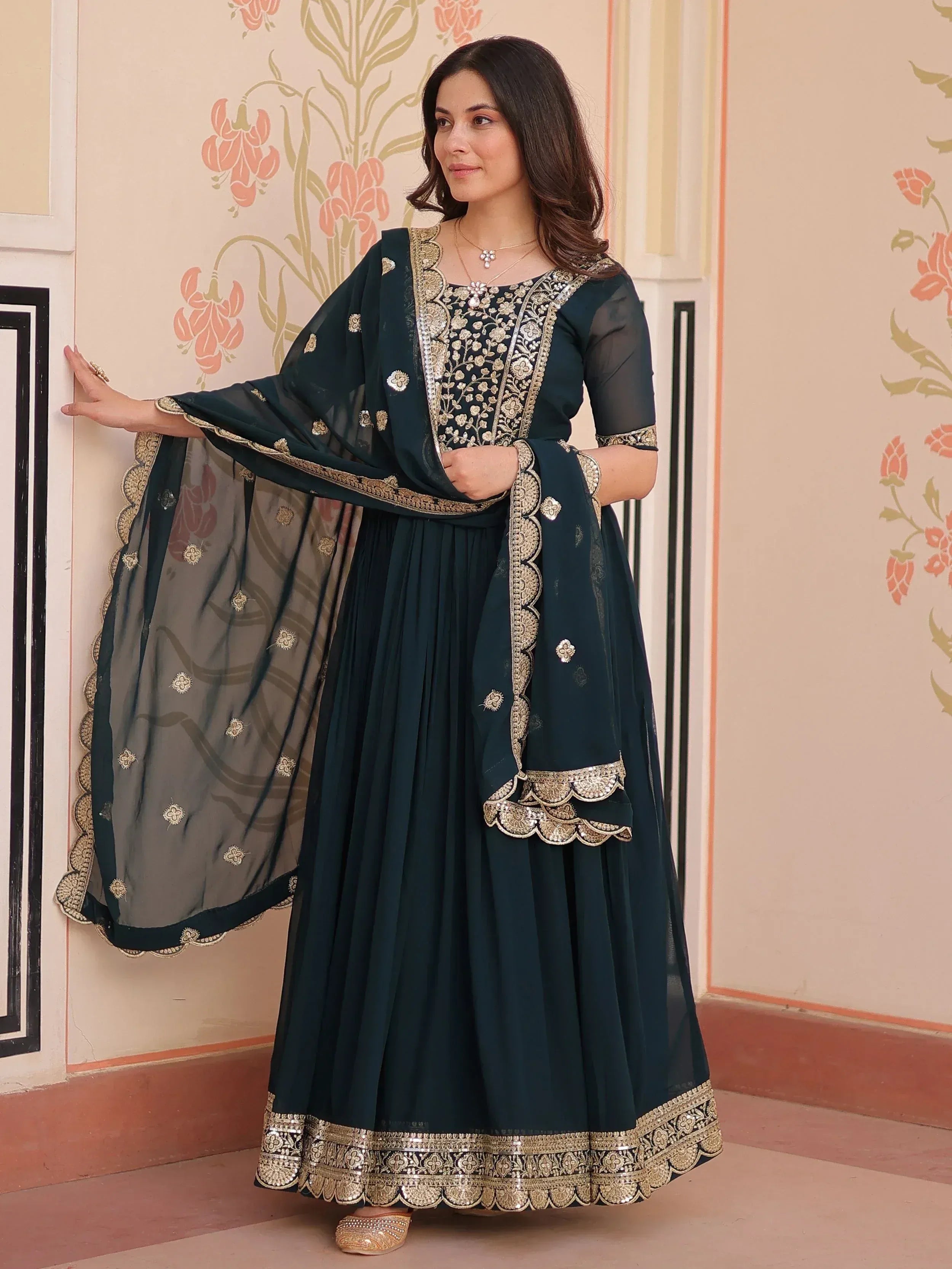 Elegant dark green anarkali with gold embroidery and matching dupatta, perfect for Indian ethnic occasions.