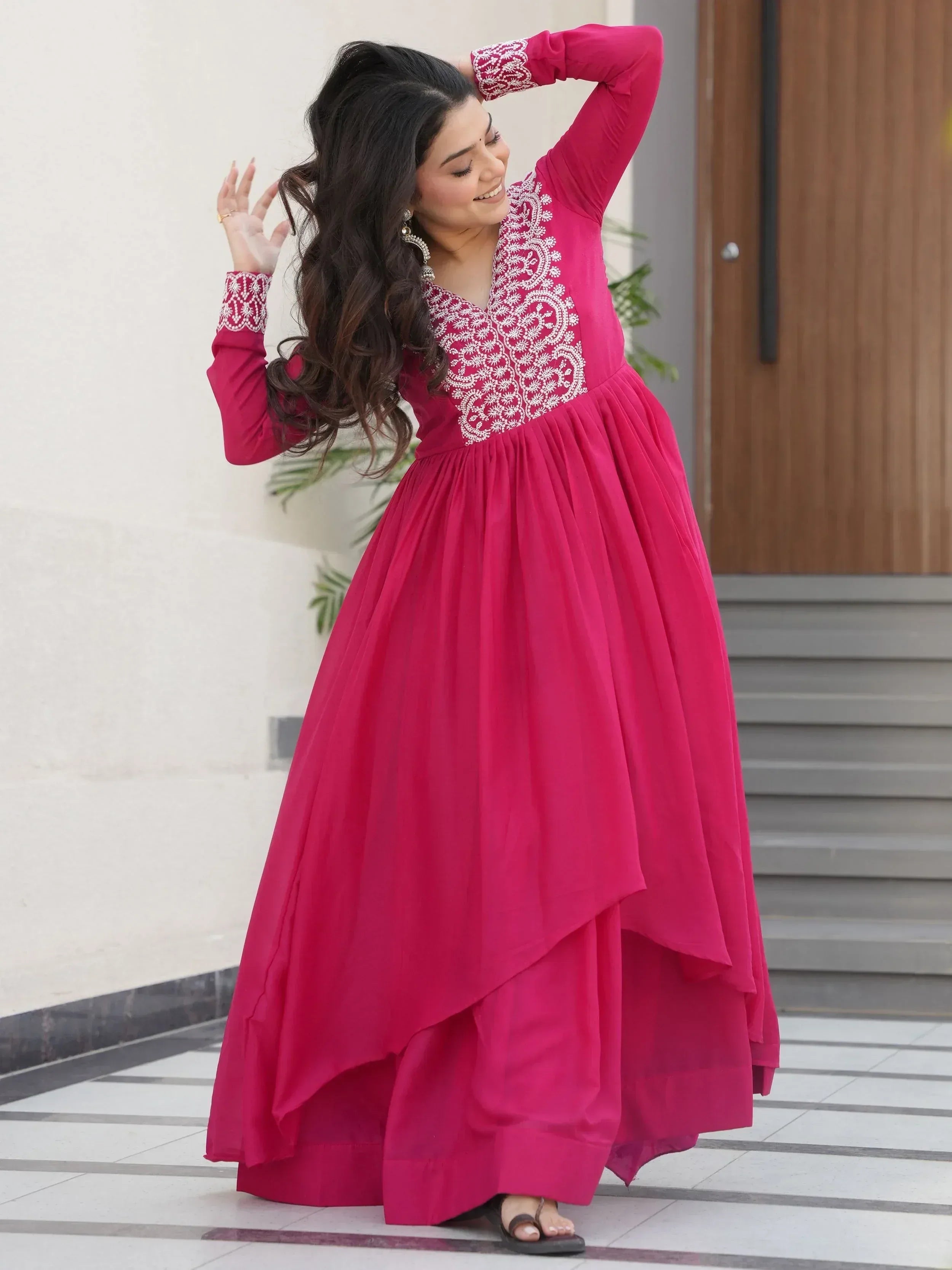 Pink ethnic gown with white embroidery, long sleeves, and high-low hem for women