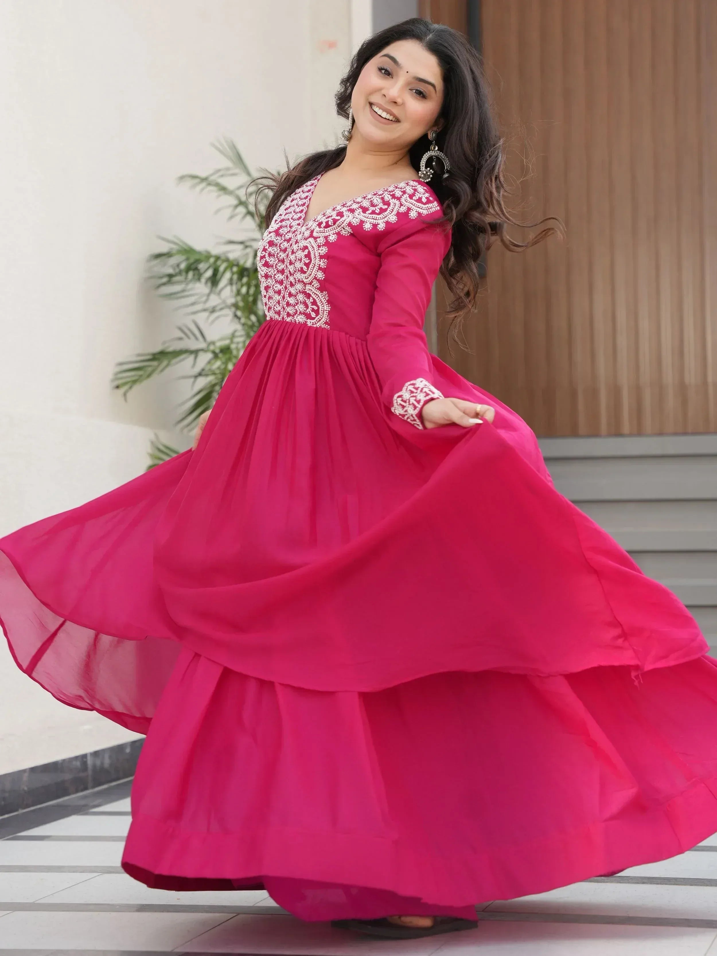 Pink ethnic gown with white embroidery, flowing skirt, perfect for Indian festive occasions