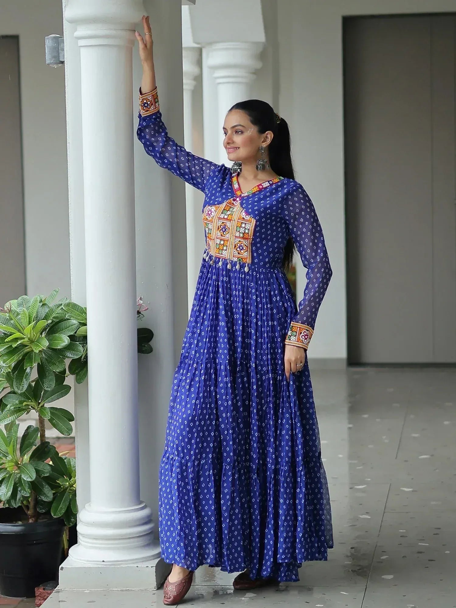 Blue printed ethnic gown with colorful embroidery, perfect for Indian occasions and festive wear.