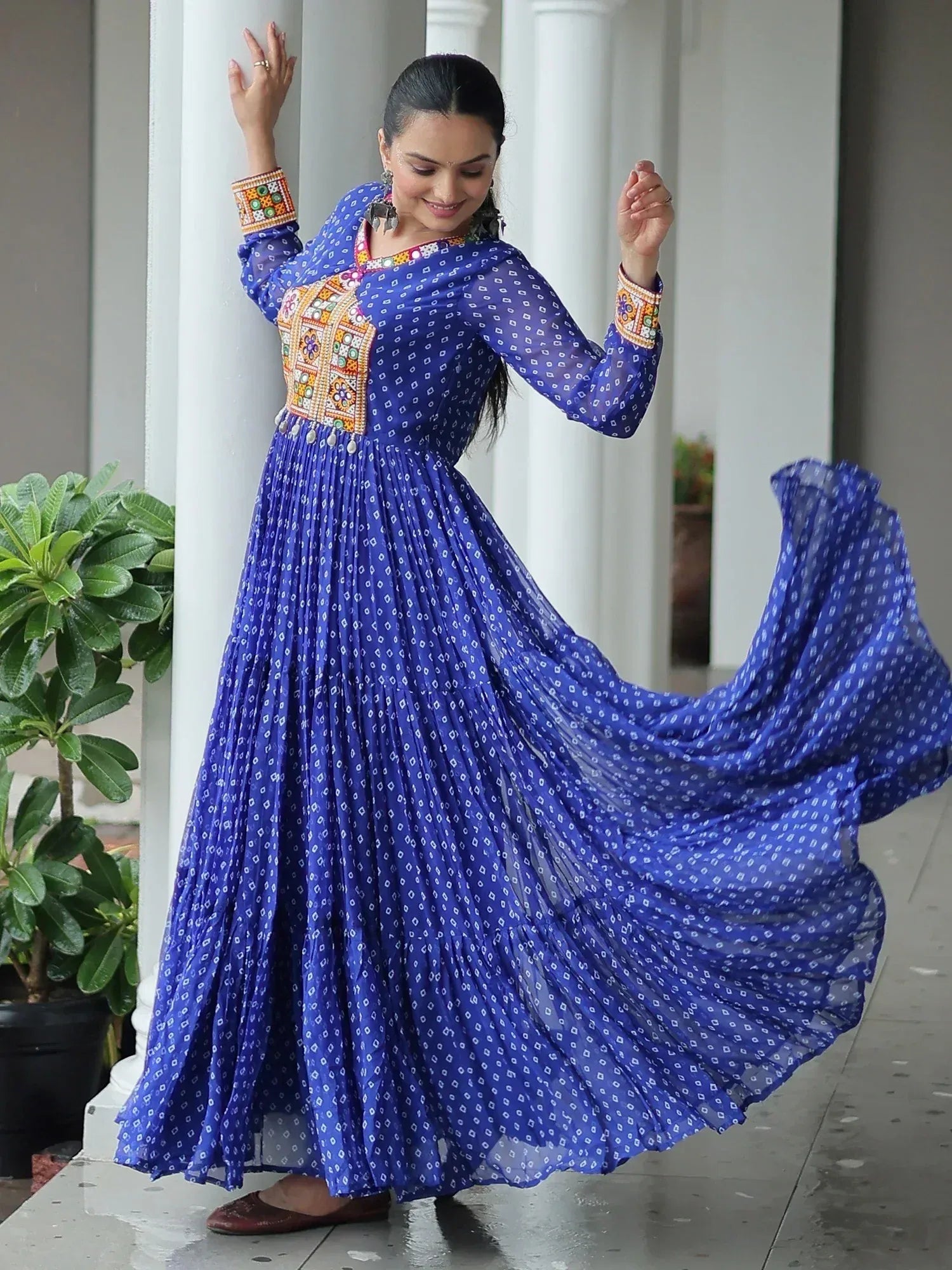 Blue printed ethnic gown with embroidered yoke and flared skirt, perfect for Indian occasions