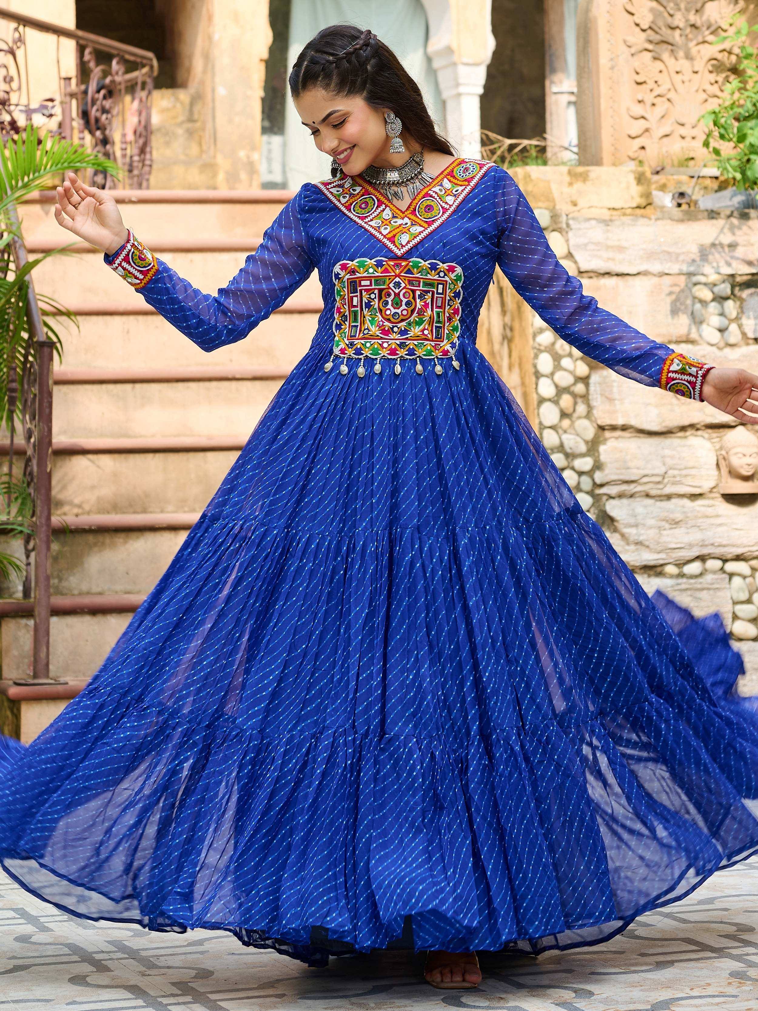 Blue ethnic gown with colorful embroidery, perfect for Indian festive occasions and traditional wear.