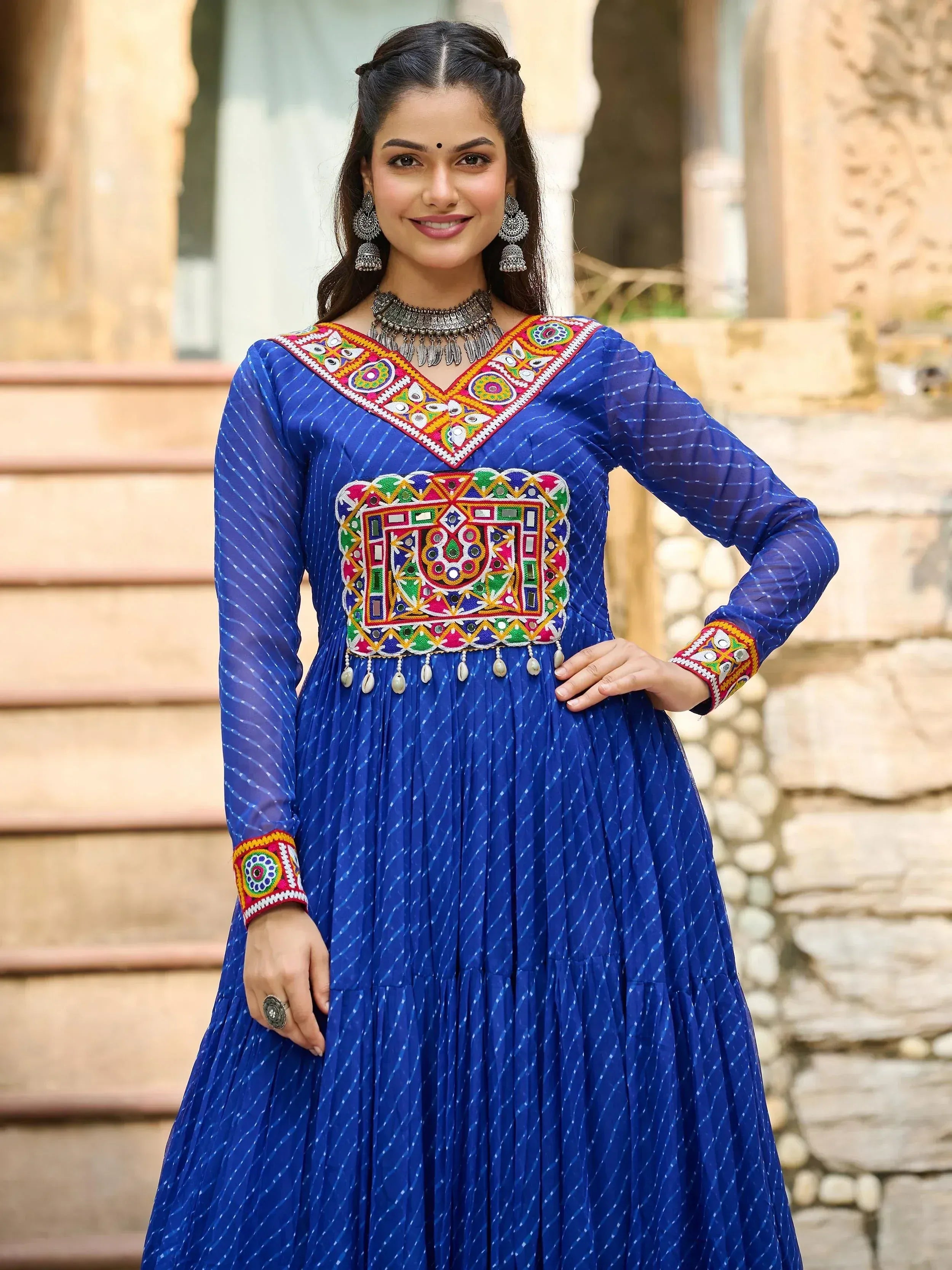 Blue ethnic gown with colorful mirror work and embroidery, perfect for Indian festive wear
