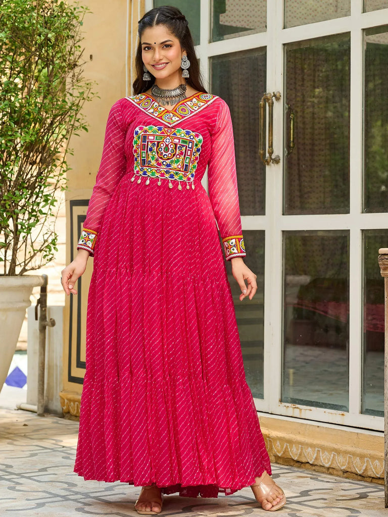 Pink ethnic gown with colorful mirror work and embroidery, perfect for Indian festive occasions