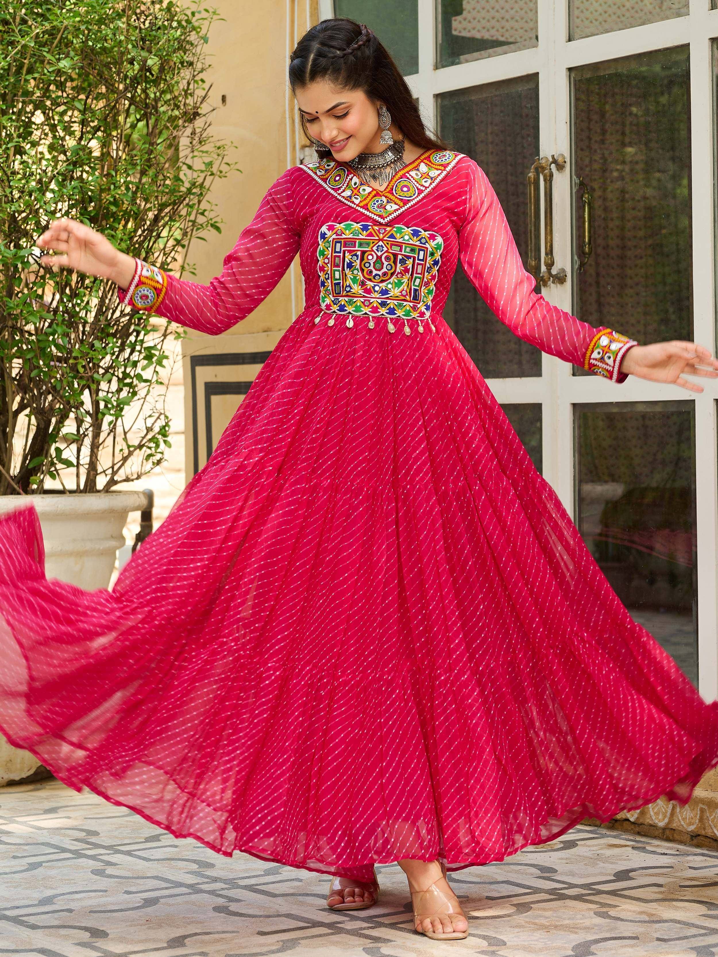 Pink ethnic gown with mirror work, perfect for Indian occasions and festive wear