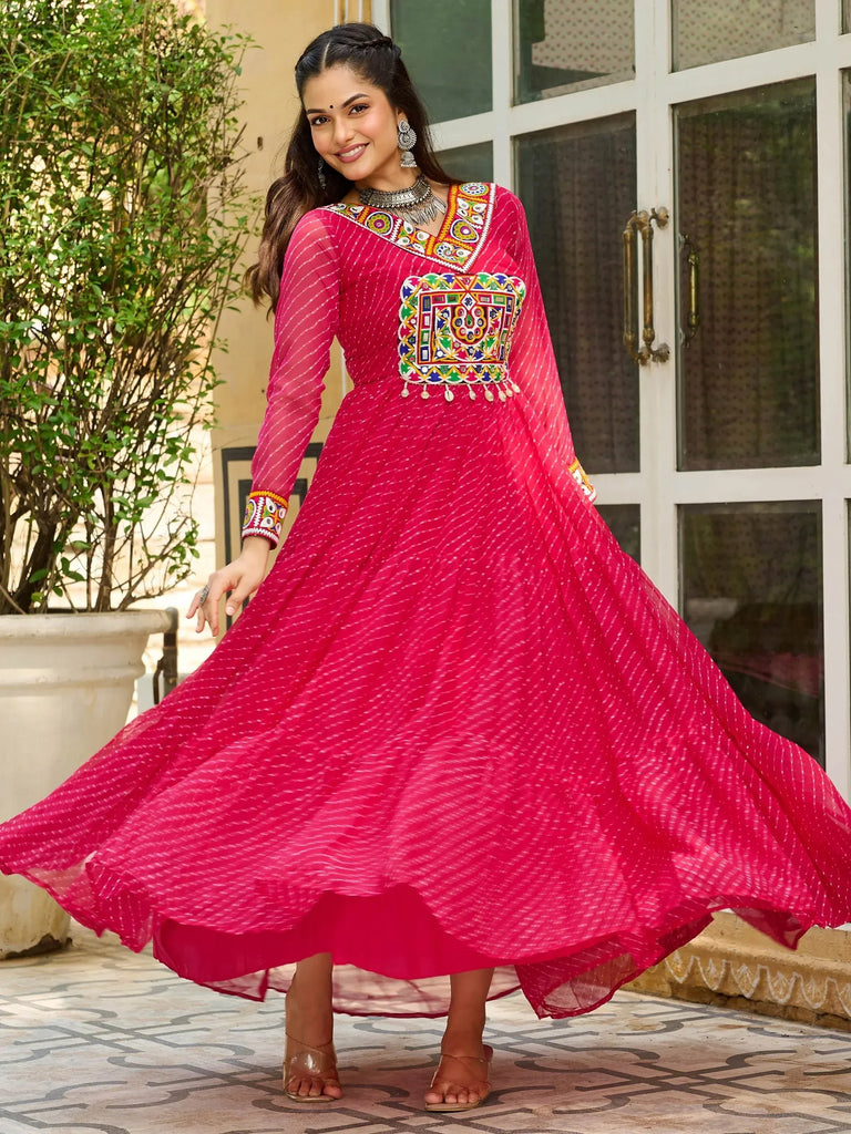 Pink ethnic gown with mirror work and embroidery, perfect for Indian occasions