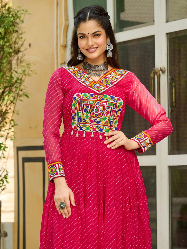 Pink ethnic anarkali with mirror work and embroidery, perfect for Indian occasions and festive wear.
