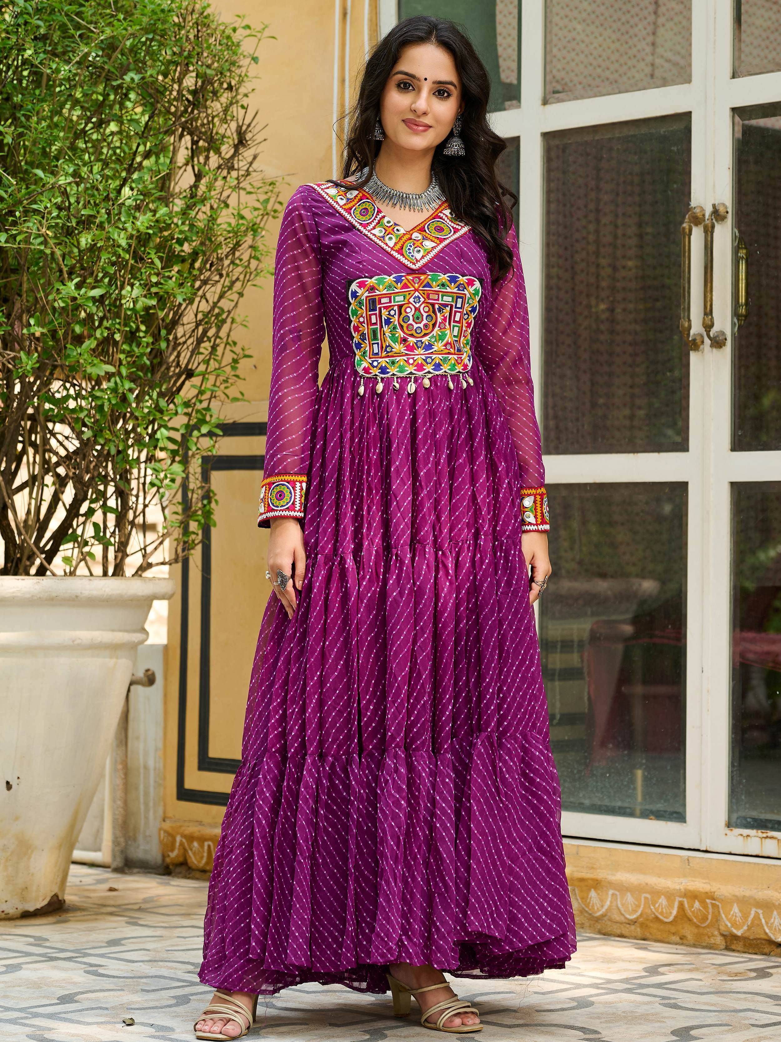 Purple ethnic gown with mirror work and embroidery, perfect for Indian festive occasions and parties.