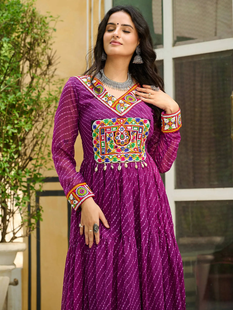 Purple ethnic gown with colorful mirror work and embroidery, perfect for Indian festive occasions