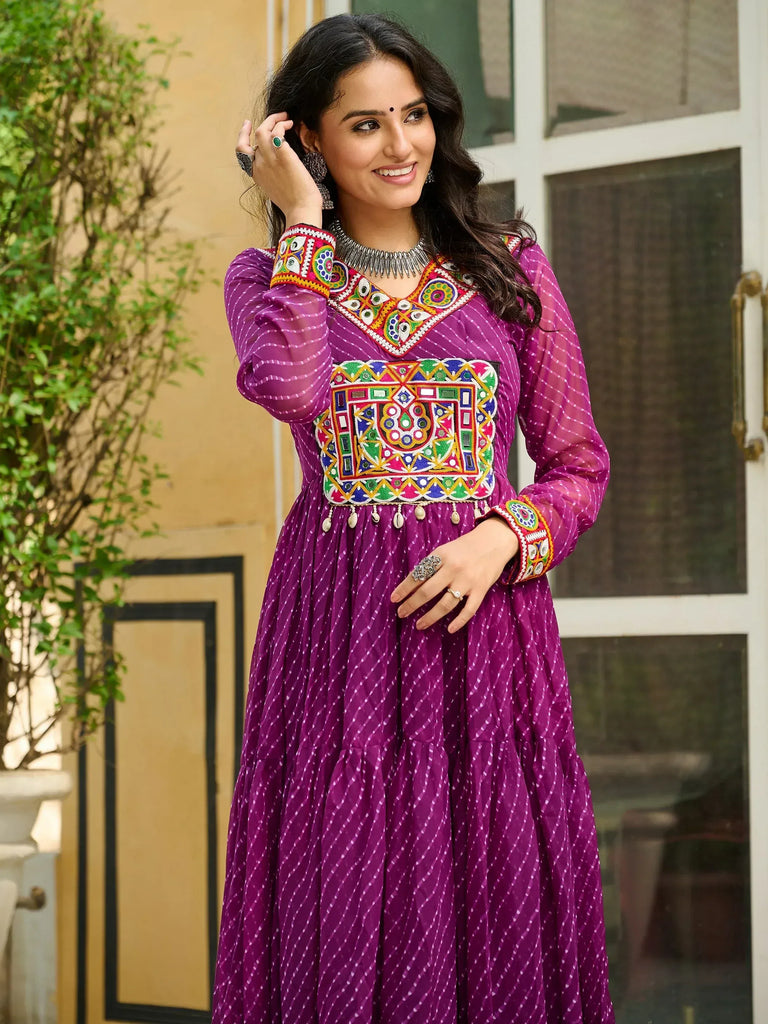 Purple ethnic gown with colorful mirror work and embroidery, perfect for Indian festive occasions