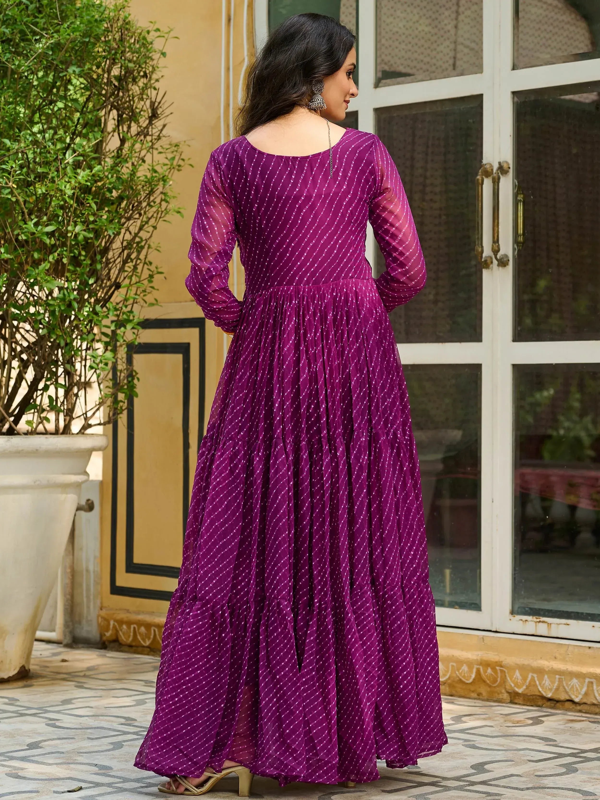 Purple ethnic gown with white dot print, long sleeves, flared skirt, back view