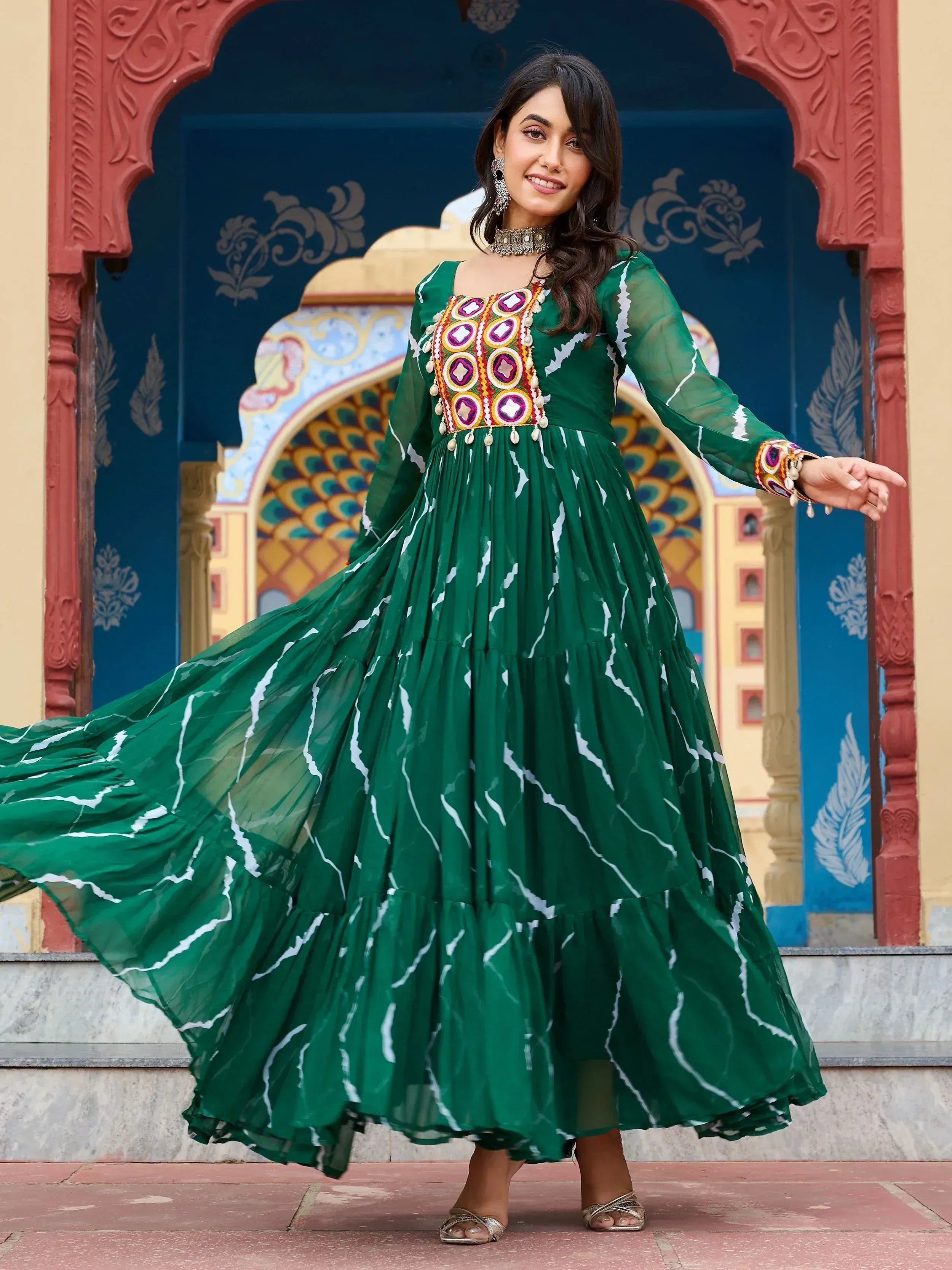 Green ethnic gown with mirror work and white print, perfect for Indian festive occasions