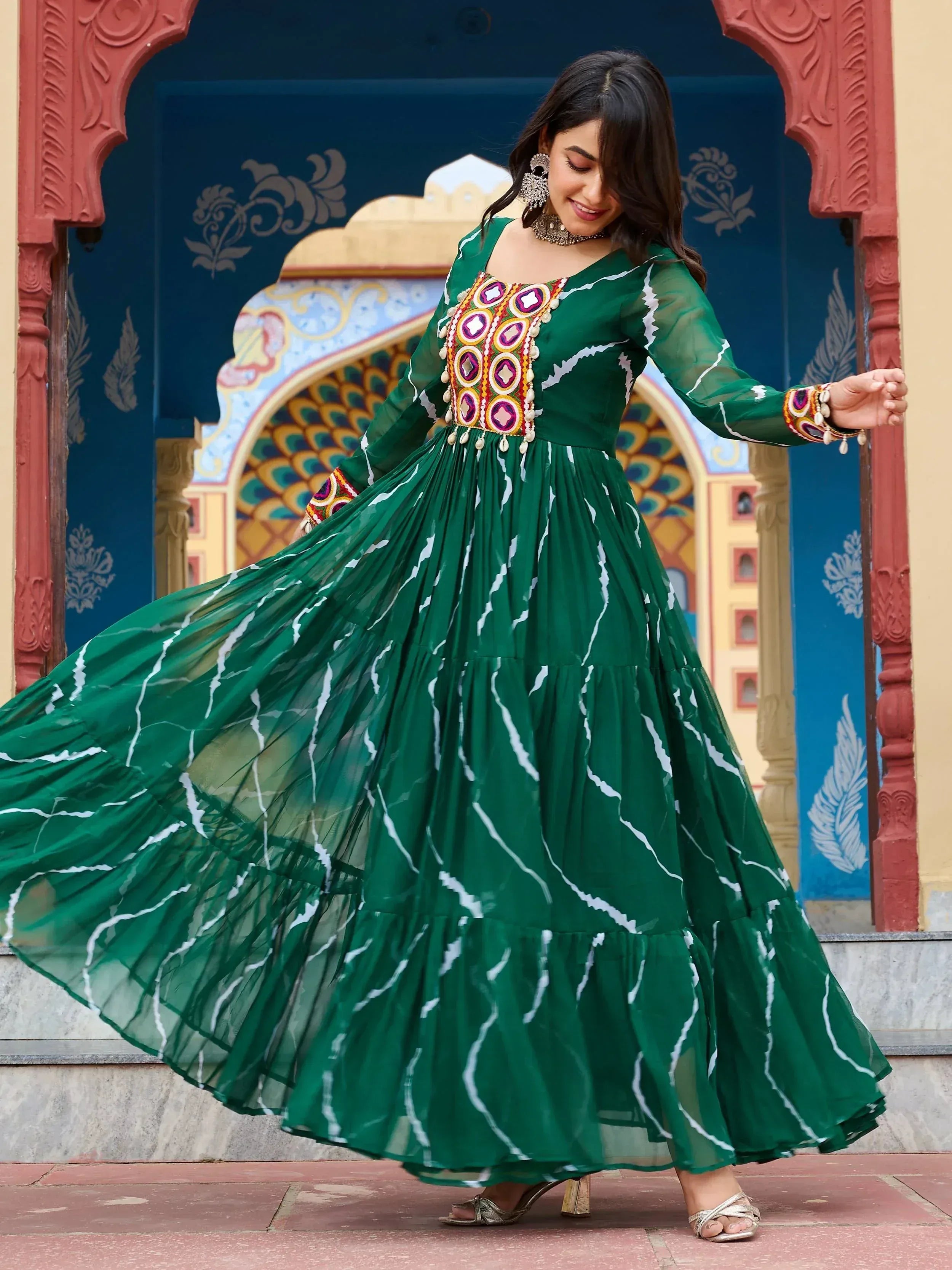 Green ethnic gown with mirror work and white print, perfect for Indian festive occasions