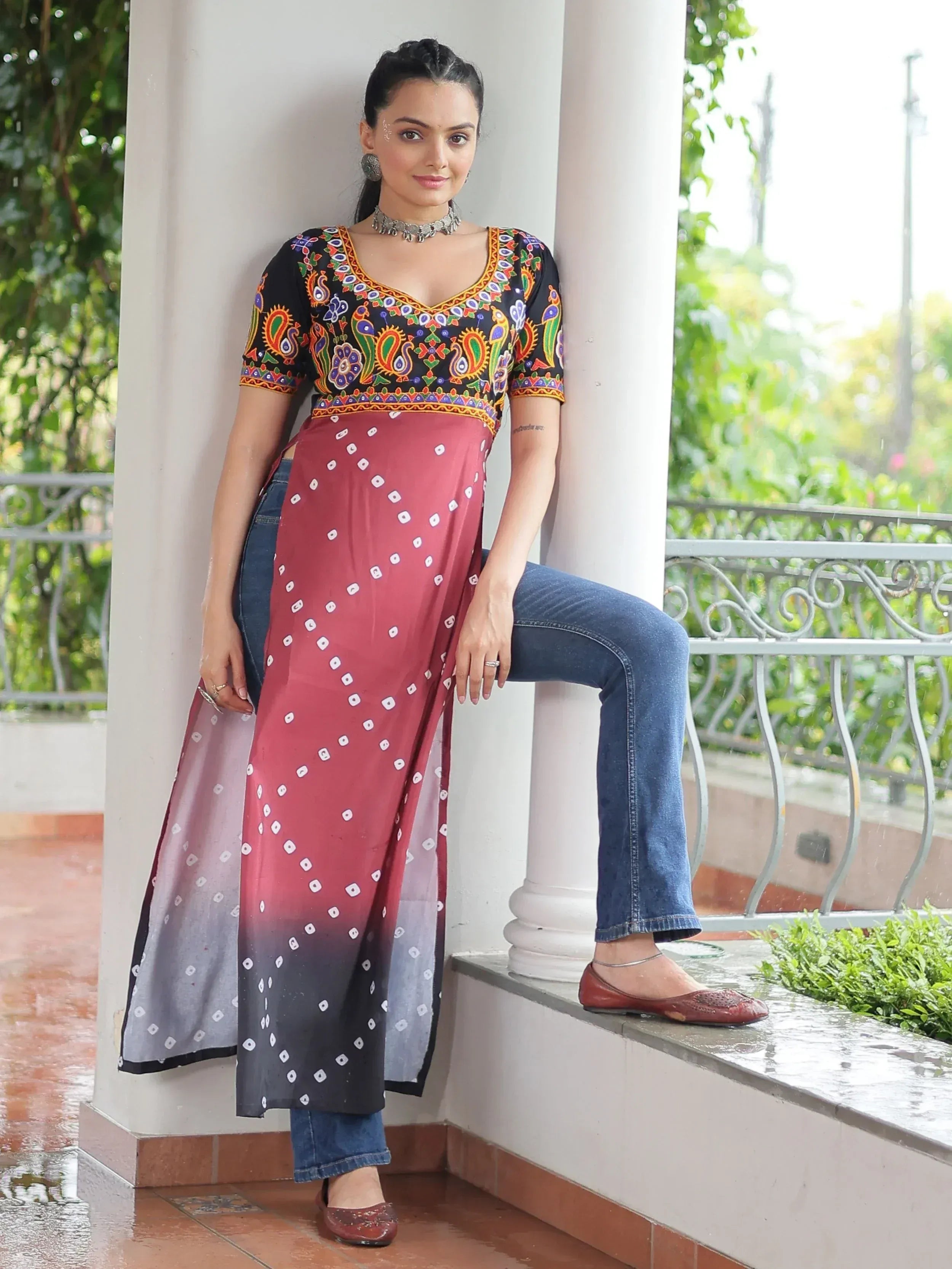 Woman in colorful embroidered kurta with ombre dupatta and jeans, Indian ethnic wear