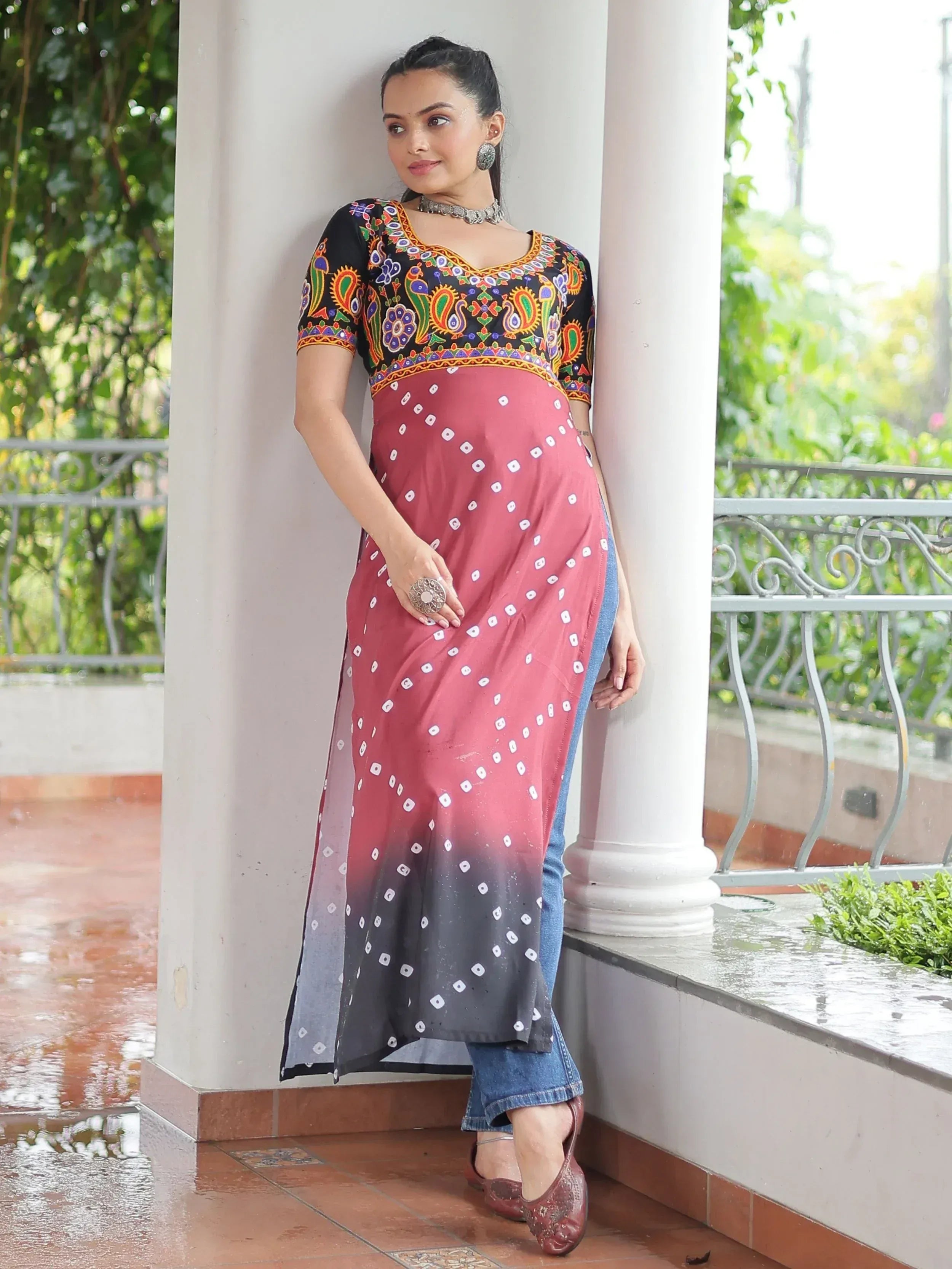 Woman in colorful embroidered kurta with ombre dupatta, styled with jeans for casual ethnic wear