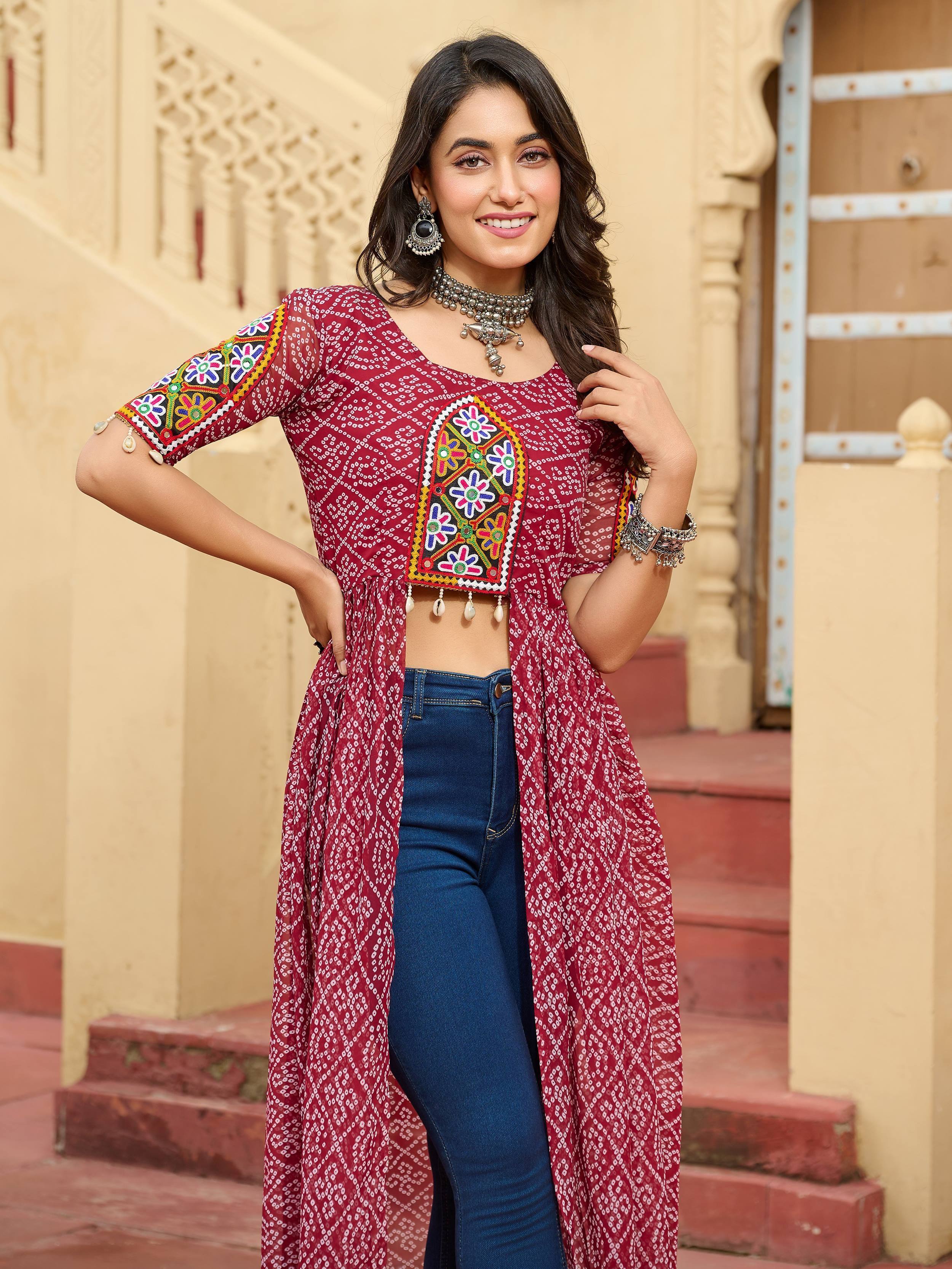 Maroon embroidered ethnic kurta with mirror work, paired with jeans, perfect for Indian festive wear