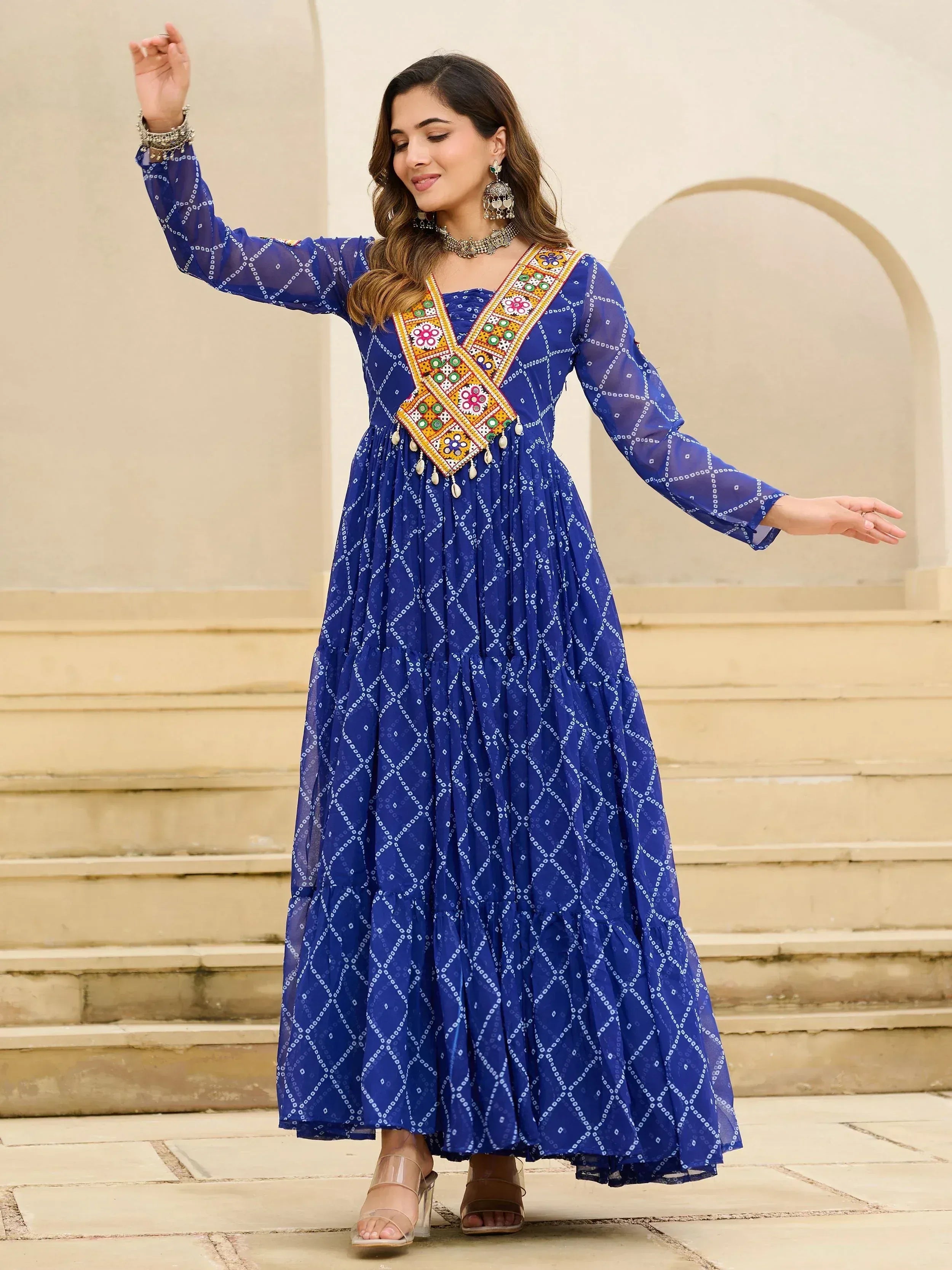Blue ethnic gown with mirror work and bandhani print, perfect for Indian festive occasions