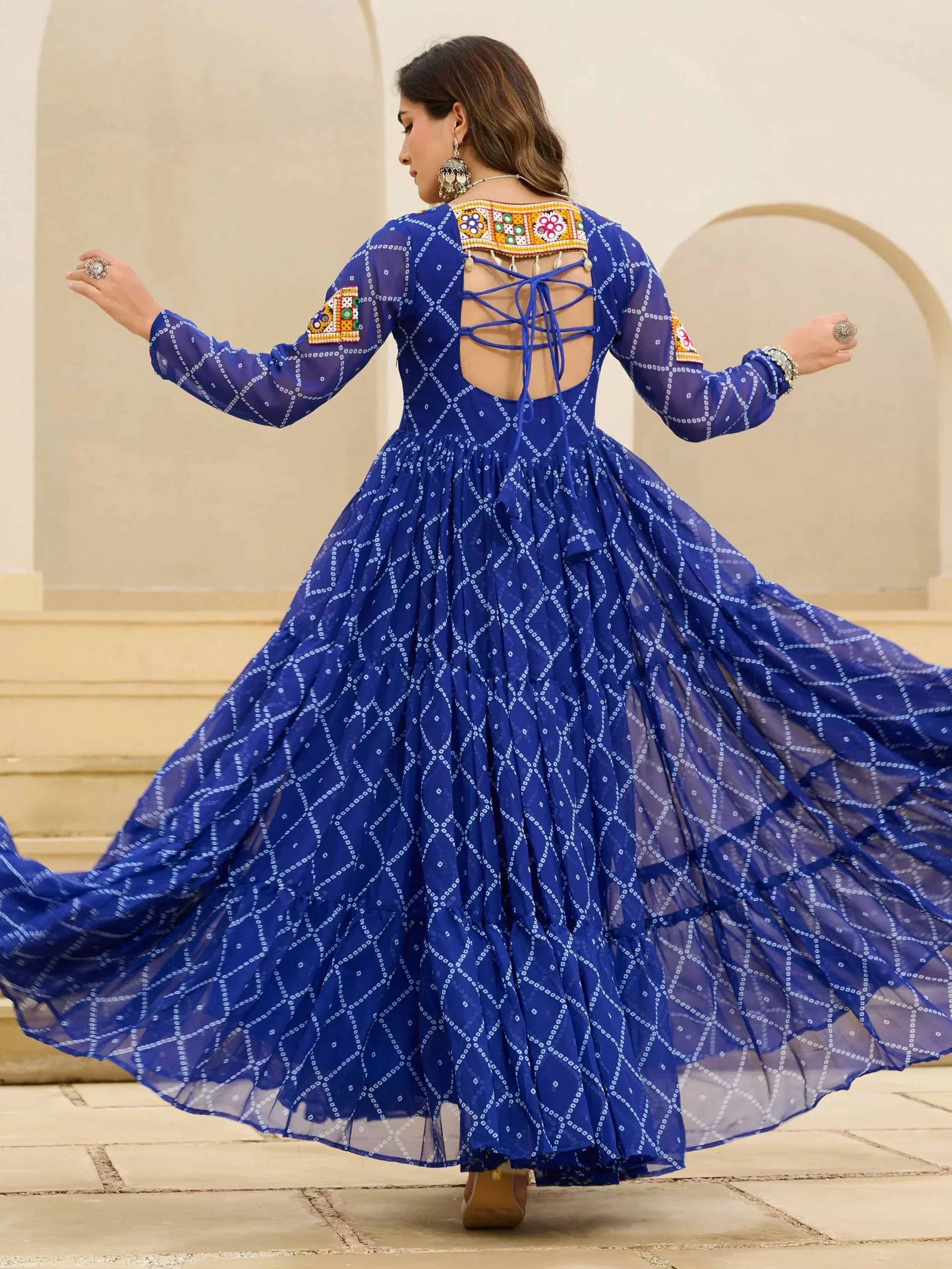 Blue ethnic gown with intricate embroidery and back lace-up design