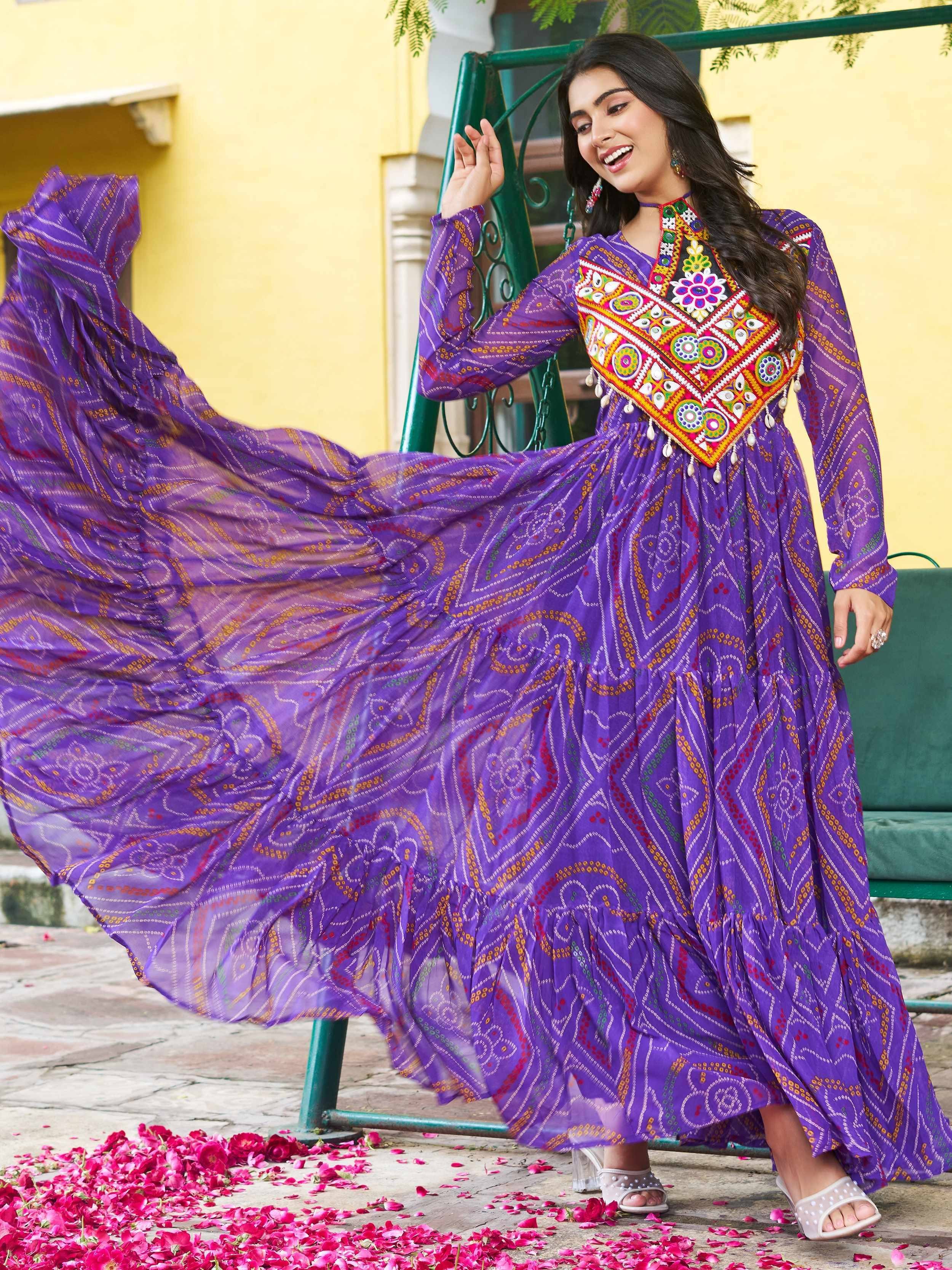 Purple ethnic gown with colorful embroidery and floral patterns, perfect for festive occasions.