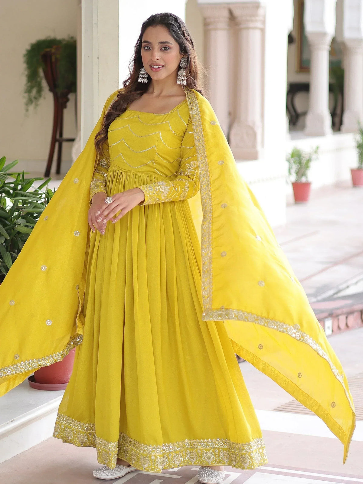 Yellow ethnic anarkali suit with gold embroidery and dupatta, perfect for Indian occasions