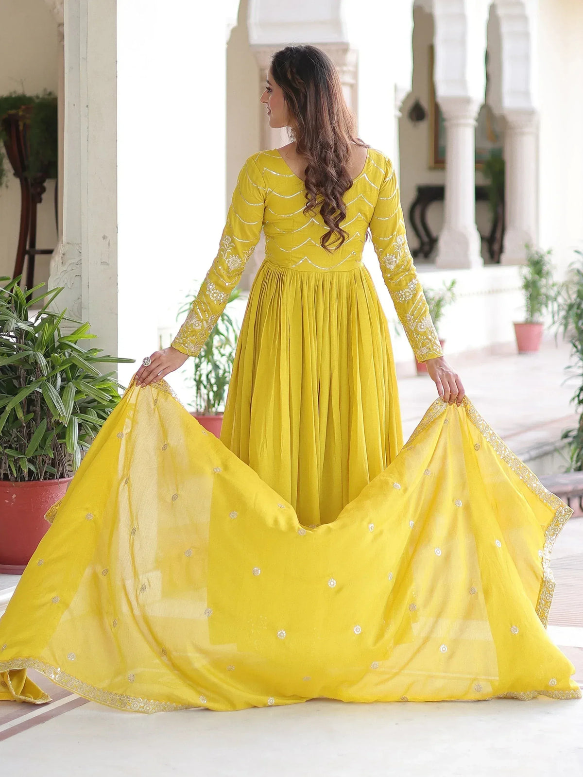 Yellow ethnic gown with embroidery and dupatta, perfect for Indian occasions