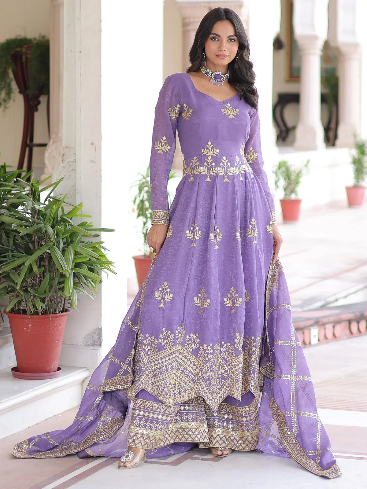 Purple ethnic gown with gold embroidery, perfect for Indian weddings or festive occasions