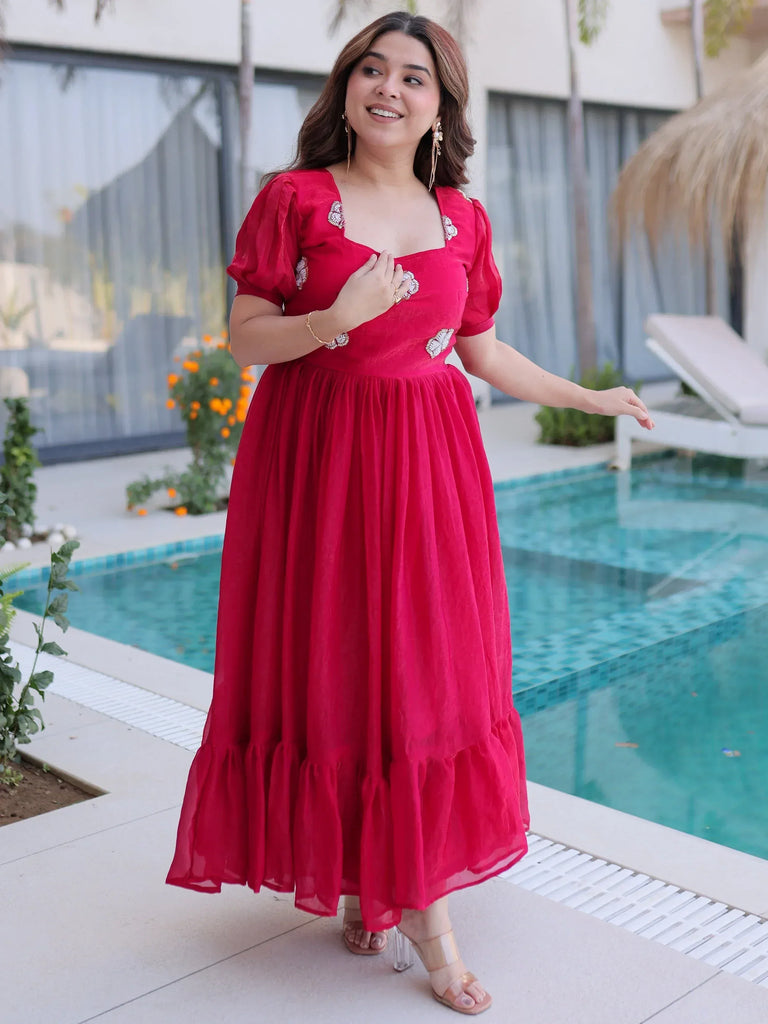 Red ethnic gown with puff sleeves and embroidery, perfect for festive occasions