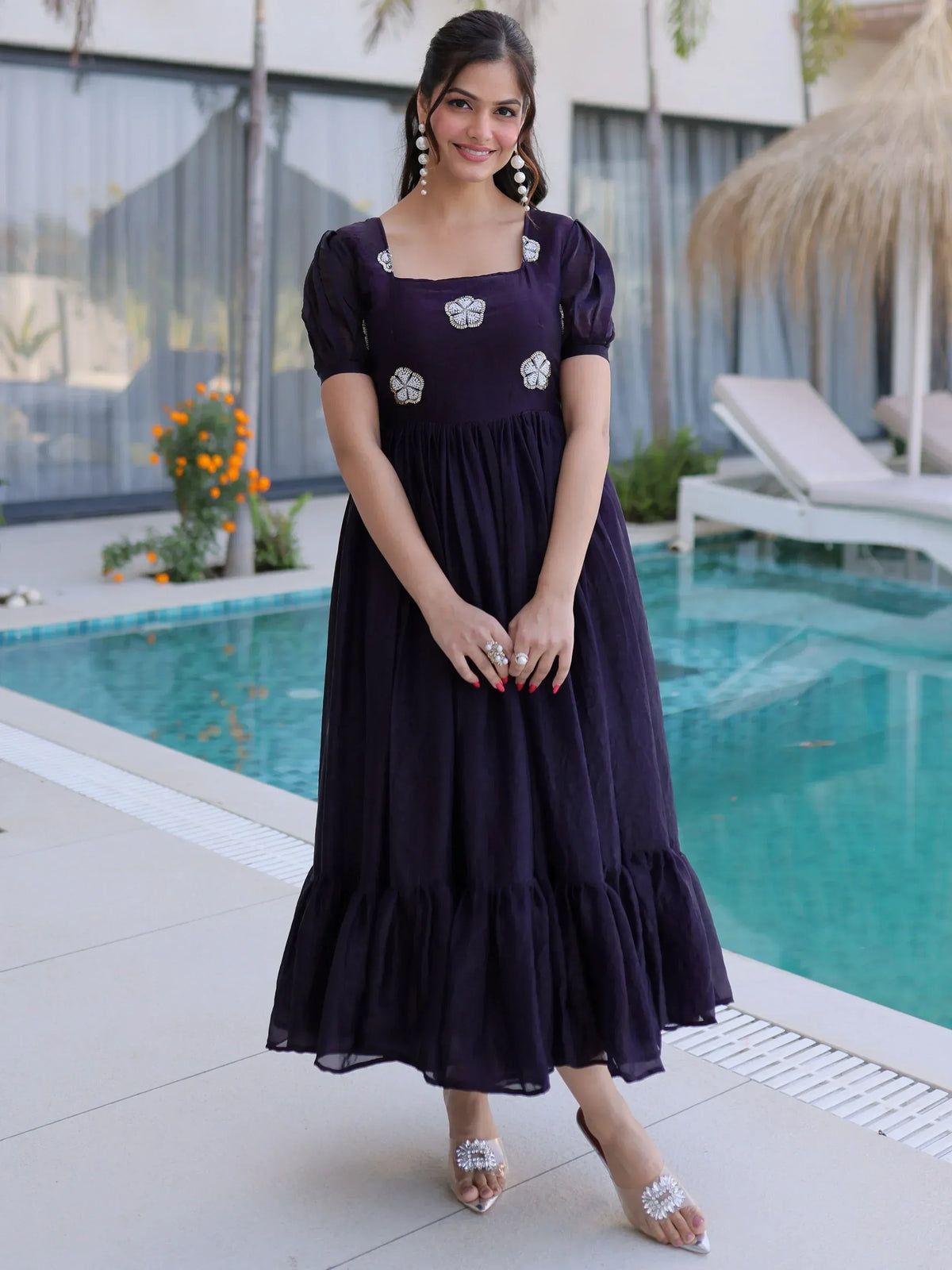 Purple ethnic gown with floral embroidery, perfect for Indian occasions, styled by poolside