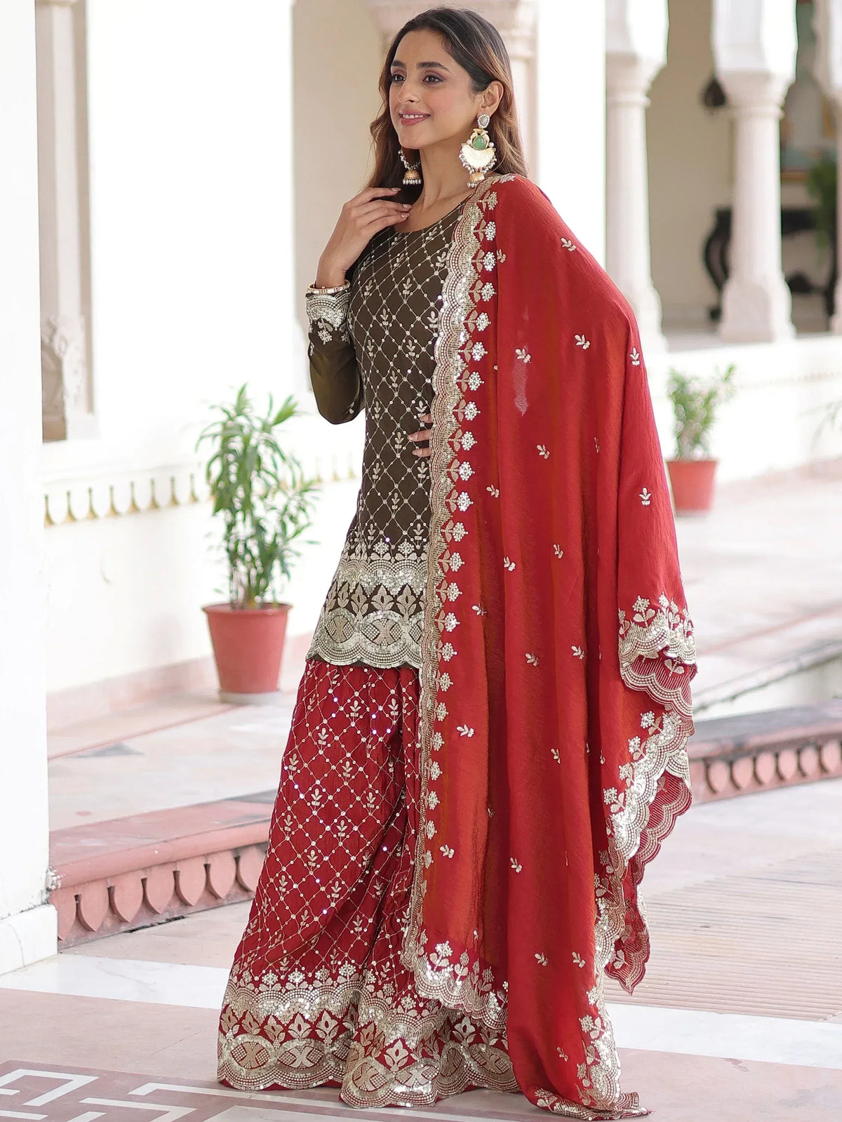 Elegant red and olive green embroidered salwar kameez with gold detailing, perfect for Indian ethnic wear occasions.