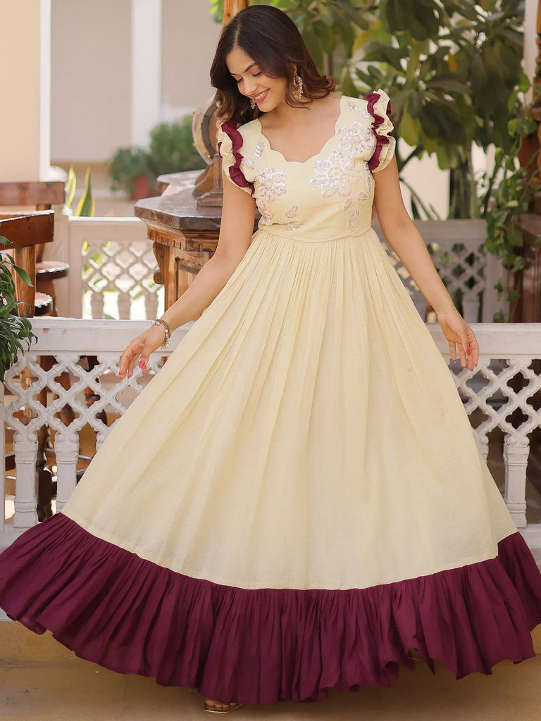 Cream and maroon ethnic gown with floral embroidery and ruffled sleeves for women