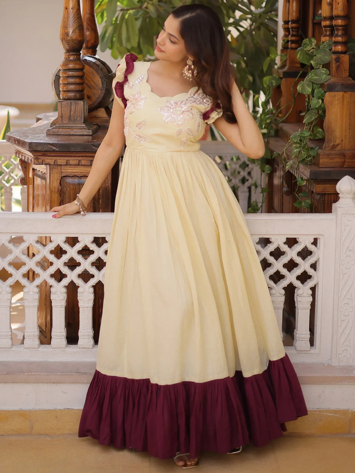Cream and maroon ethnic gown with floral embroidery, perfect for Indian occasions