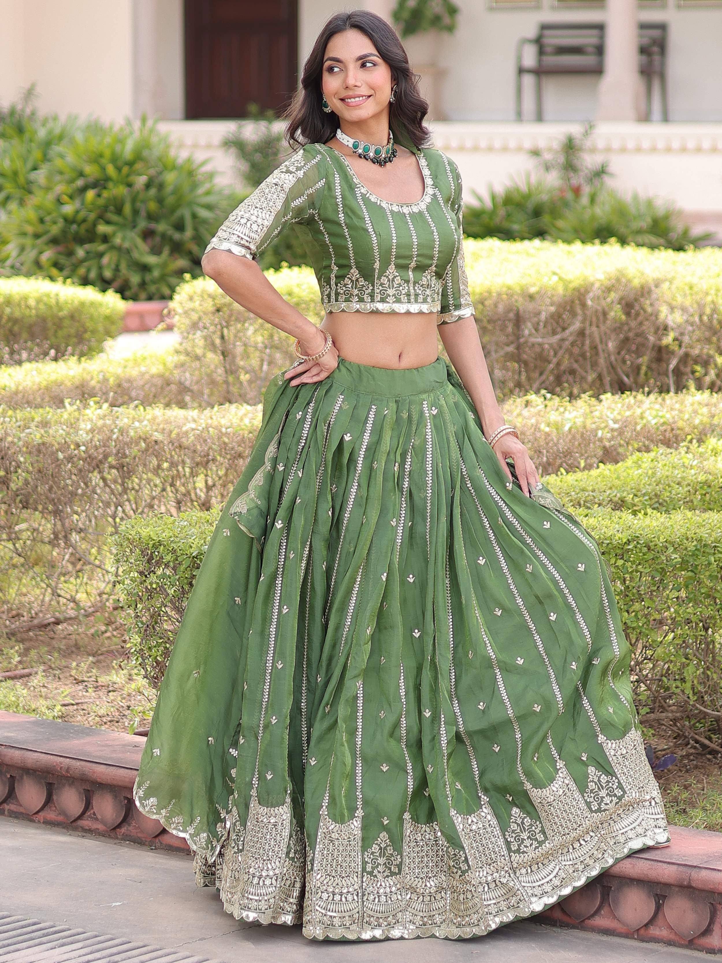 Green embroidered lehenga choli with gold detailing, perfect for Indian ethnic wear occasions