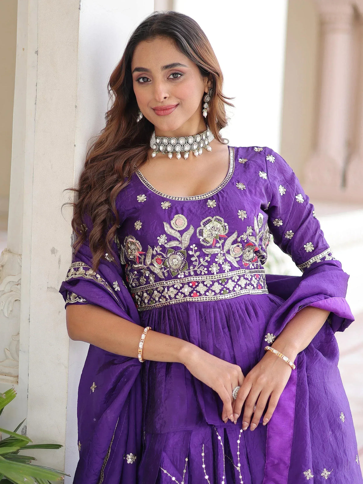 Purple embroidered ethnic gown with floral design, perfect for Indian occasions and festive wear.
