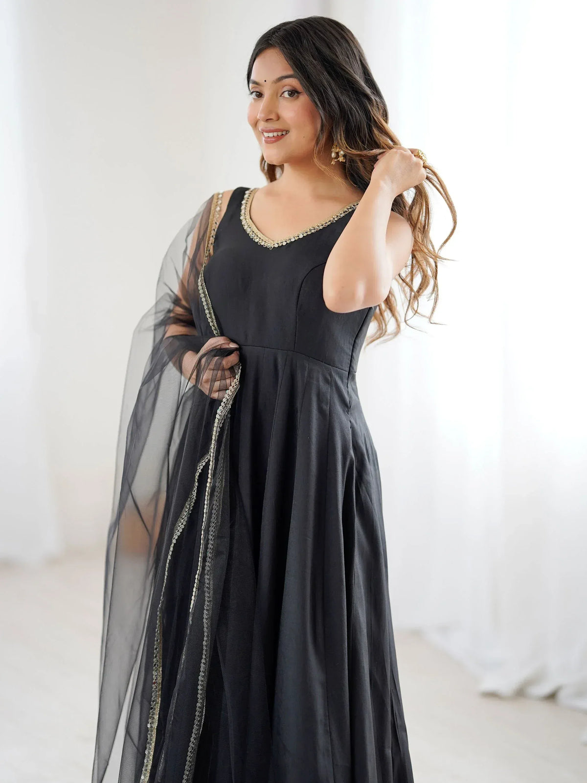Black ethnic gown with gold embroidery and sheer dupatta for women